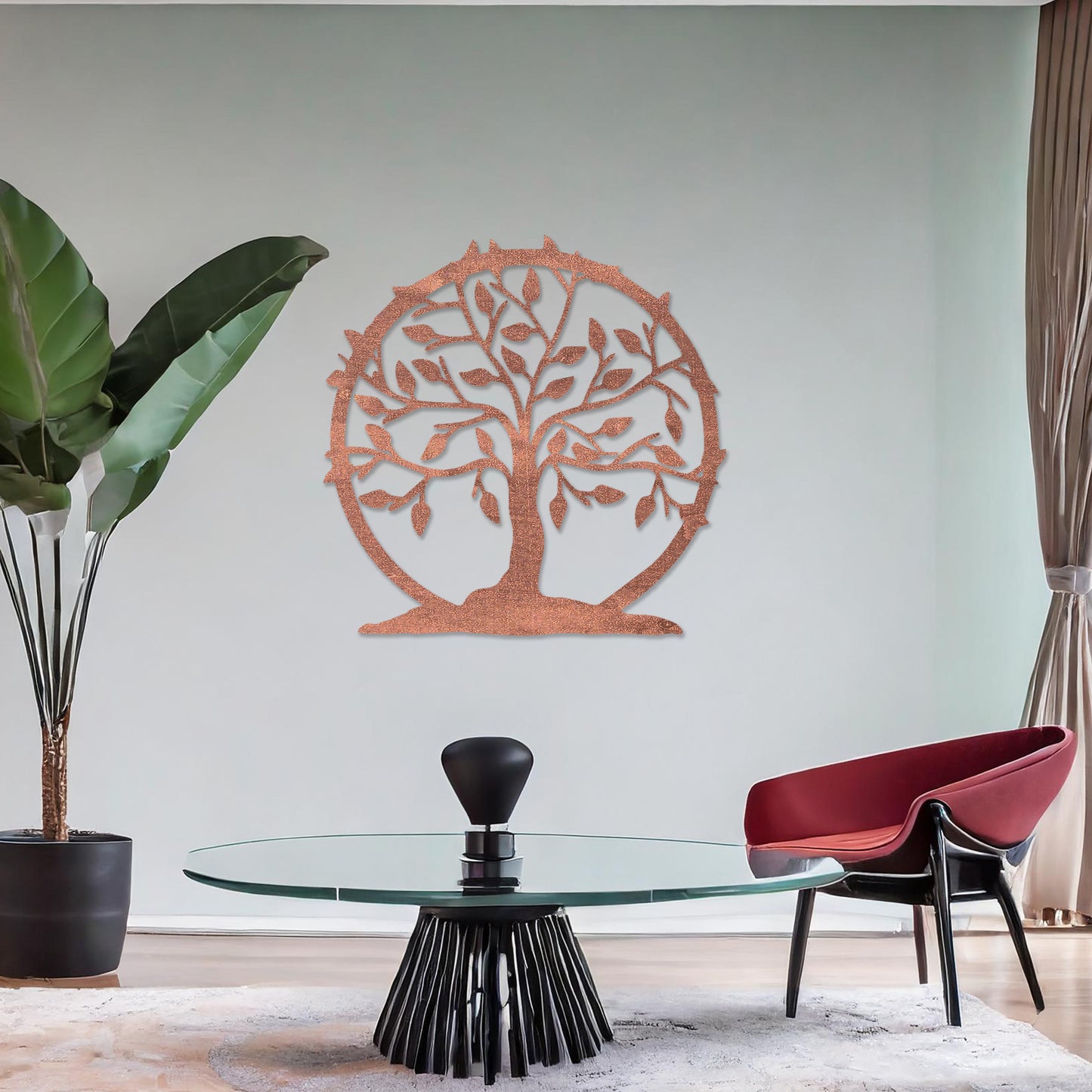 Wooden wall art featuring a circular tree design with branches, leaves, and a border of thorns. The artwork is displayed on a neutral wall within modern room decor, emphasising its natural and symbolic charm.