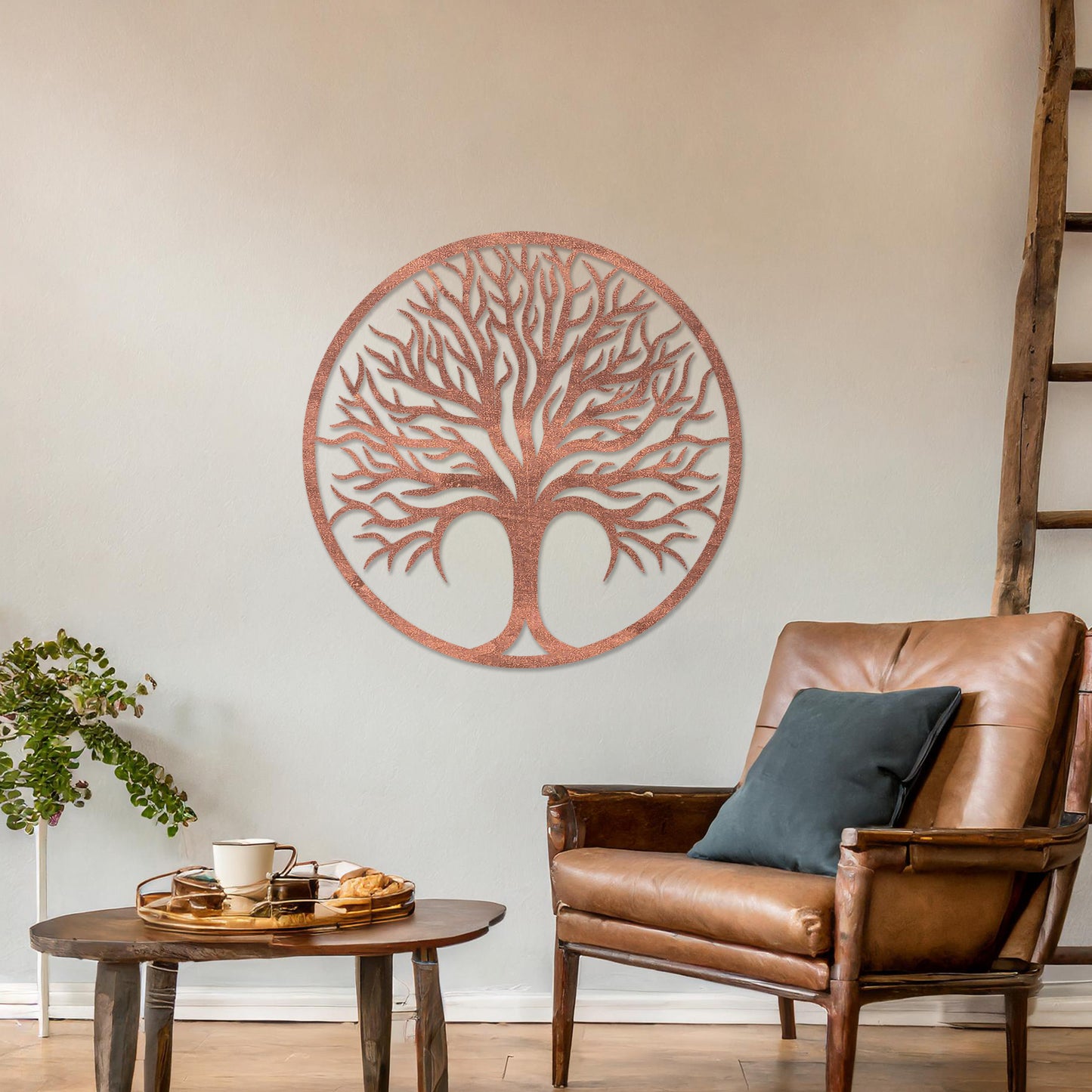 Circular wall art featuring a detailed tree design with spreading branches, symbolising life and growth. This piece is displayed on a neutral wall in a modern room, complementing the elegant and contemporary decor.