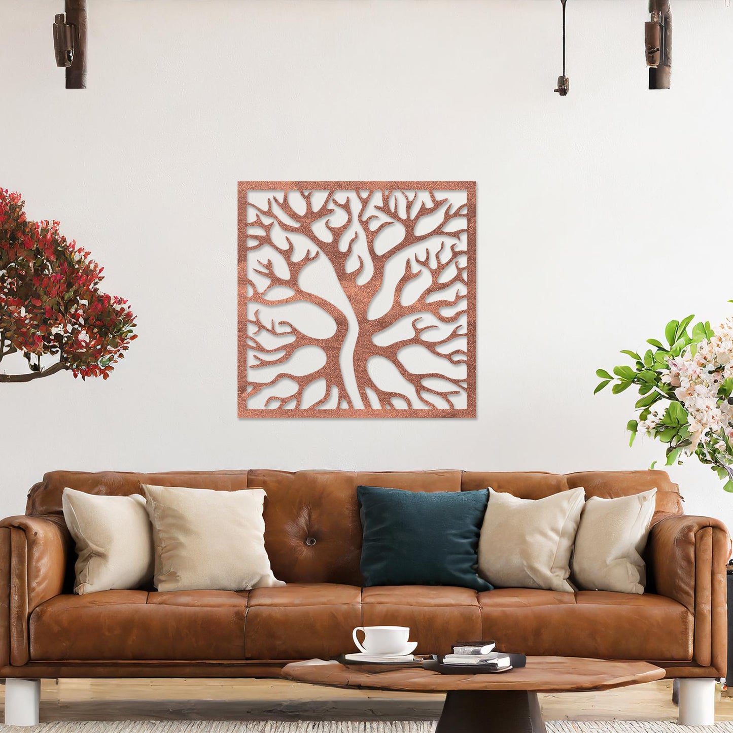 Square wall art featuring a stylised tree with intertwining branches, showcasing a modern and organic design. The artwork is displayed on a neutral wall in a contemporary living room with a sleek sofa and complementary decor.