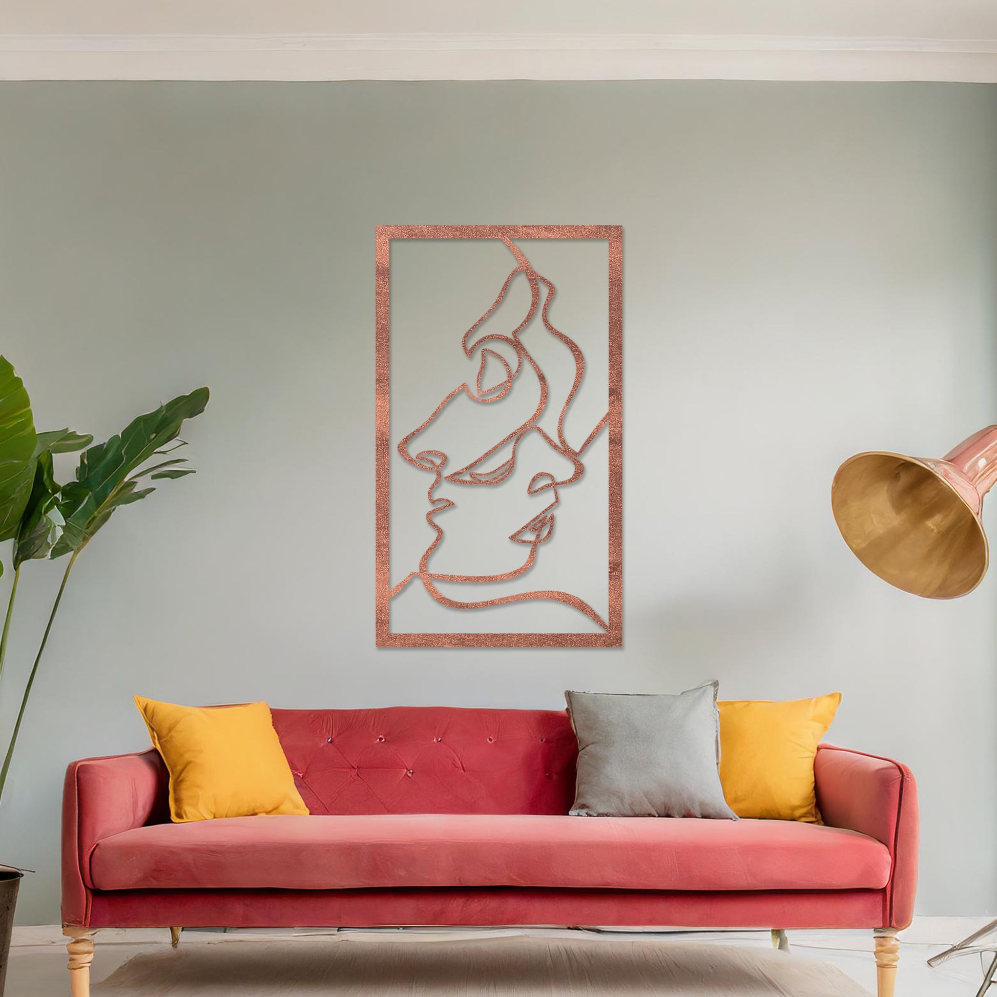 Wooden wall art design featuring abstract line art of two faces, placed on a neutral wall with modern room decor. The design is minimalistic and elegant, capturing human forms through flowing lines.