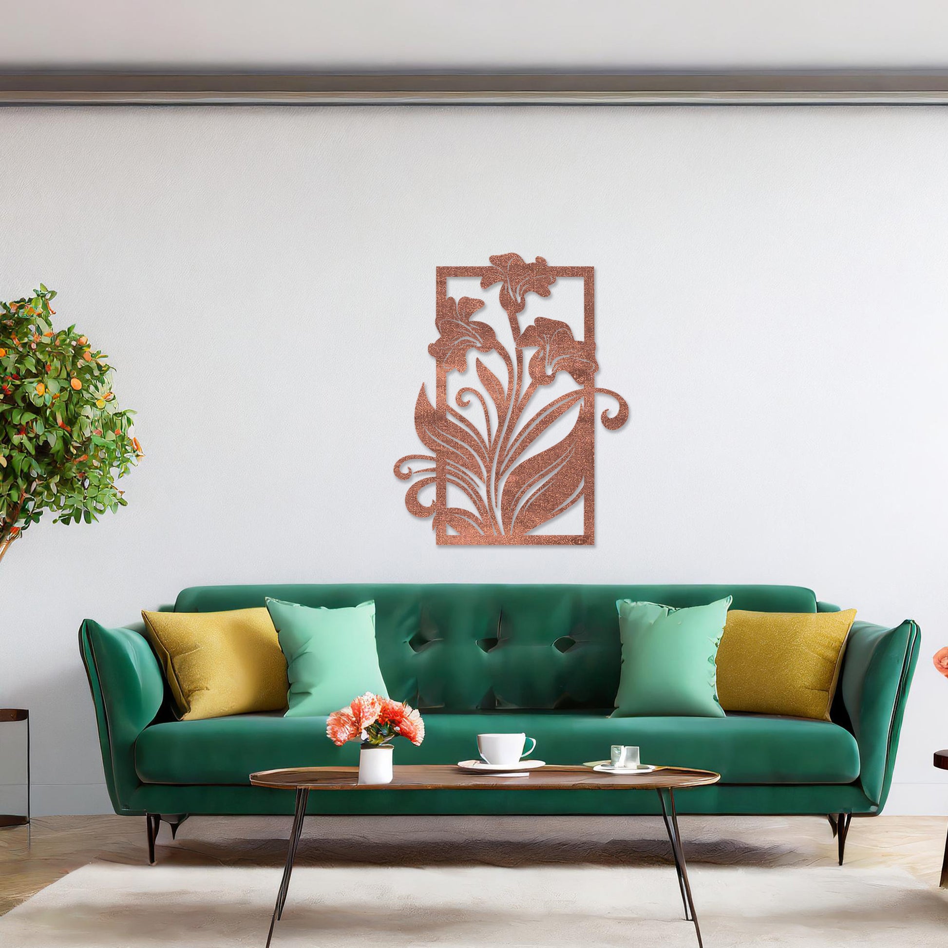 Wall art featuring an elegant floral design with three blooming lilies and flowing leaves enclosed in a rectangular frame. The piece is displayed on a neutral wall within modern room decor, adding a graceful and artistic touch to the setting.