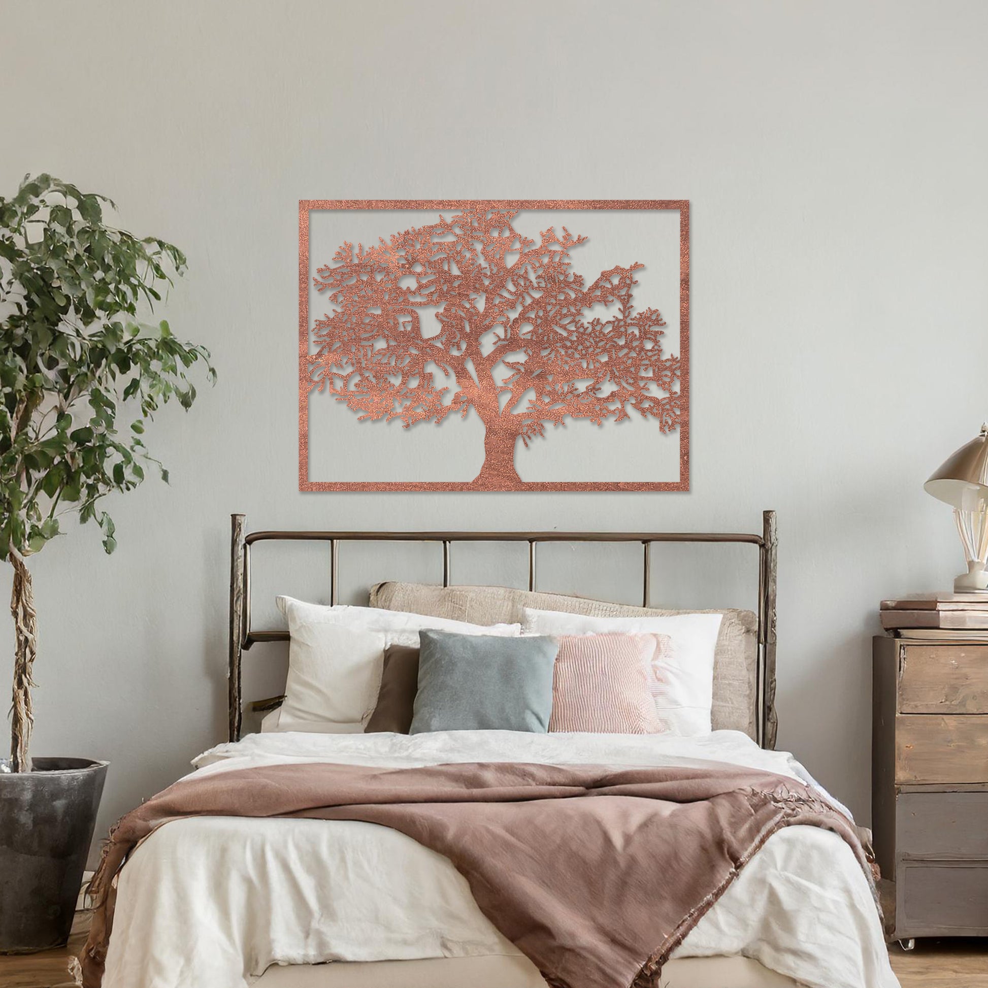 Wooden wall art featuring a rectangular tree design with detailed branches and leaves, displayed on a neutral wall within modern room decor, showcasing its natural and intricate craftsmanship.