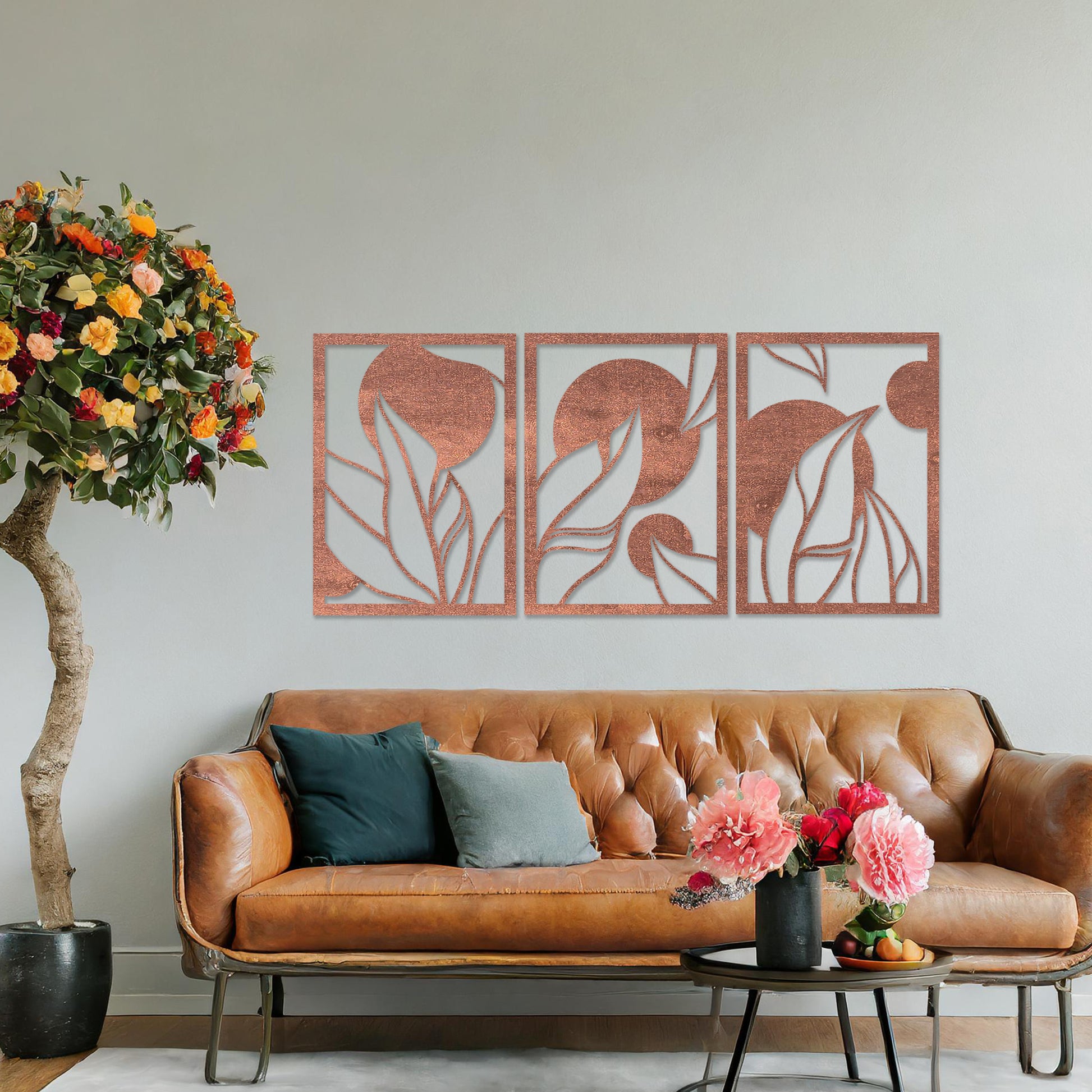 Wooden wall art design featuring a three-panel composition with abstract shapes and flowing leaves, placed on a neutral wall within modern room decor. The design blends geometric forms and natural elements for a contemporary aesthetic.