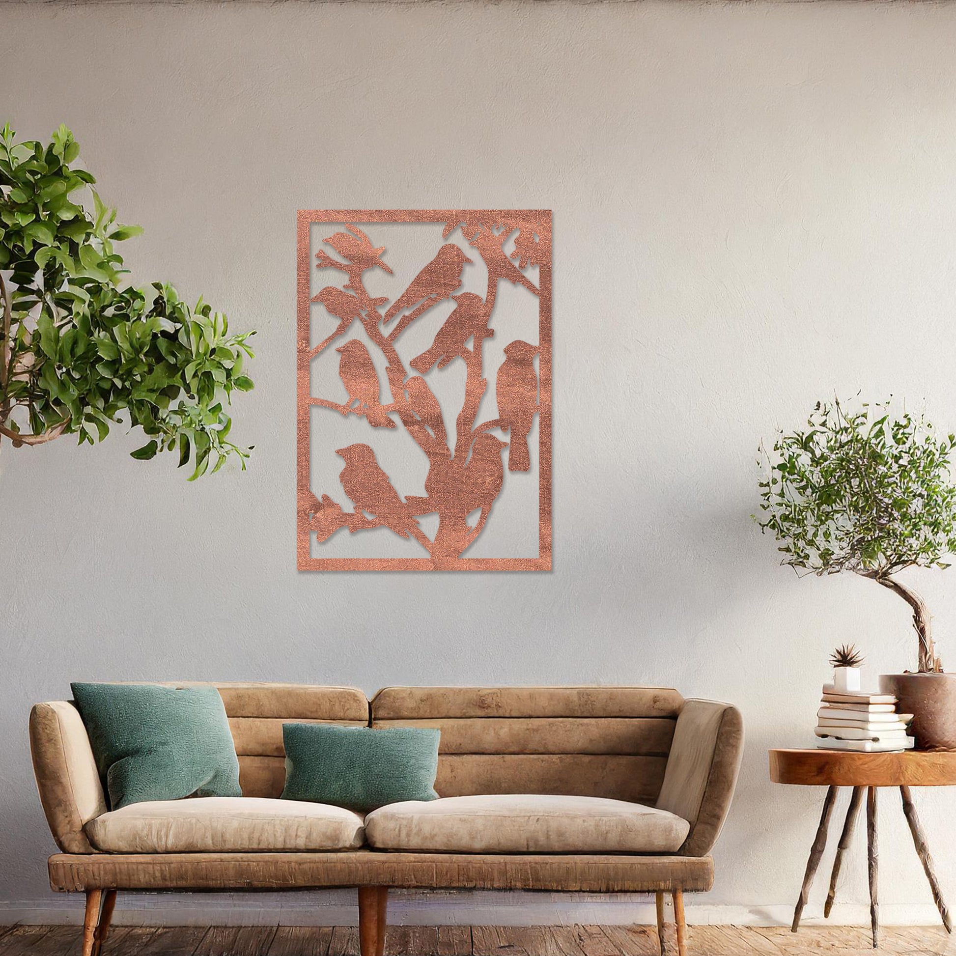 Wooden wall art featuring a detailed design of birds perched on branches. The artwork is displayed on a neutral wall within modern room decor, highlighting the intricate natural pattern.