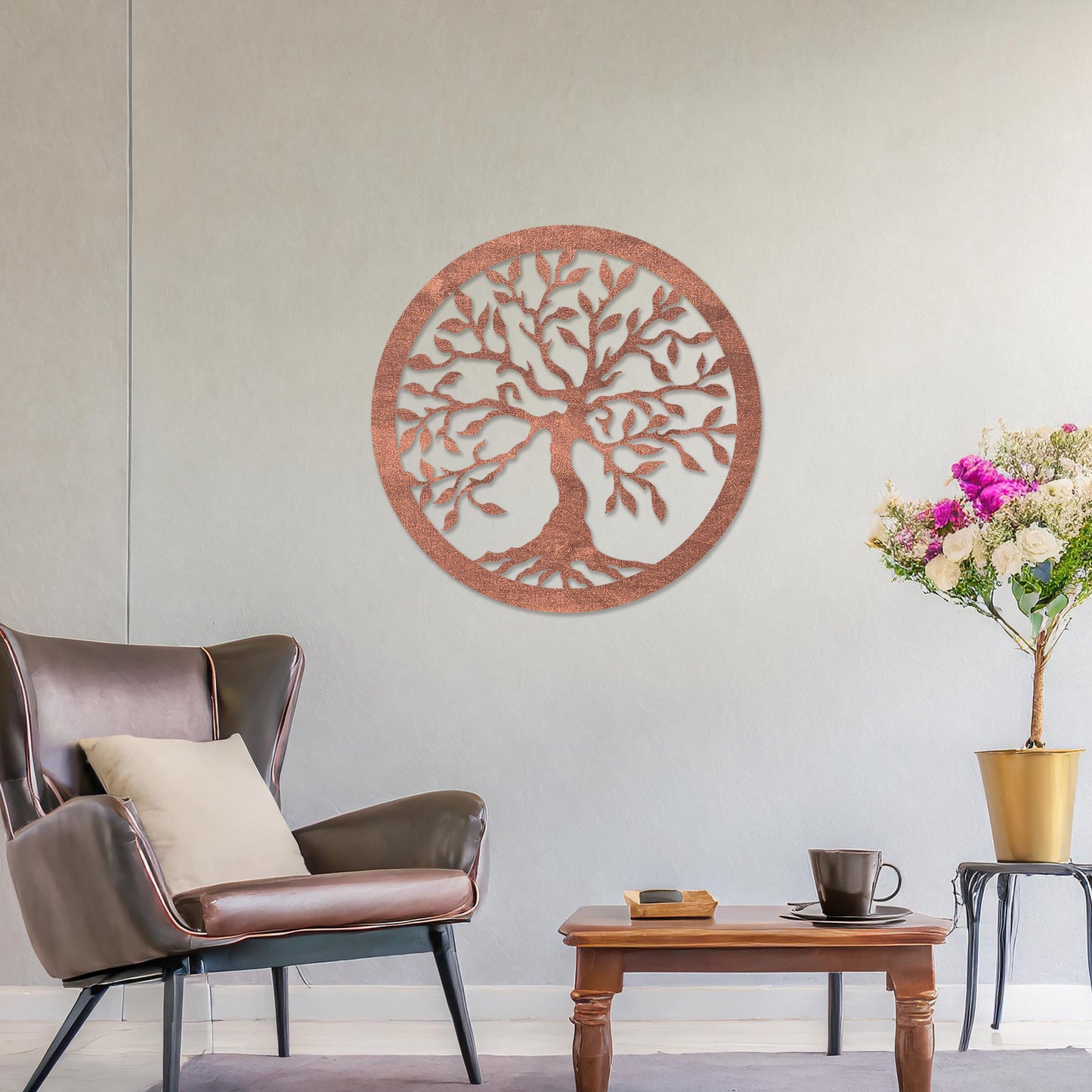Round wooden wall art featuring an intricately designed tree with sprawling branches and delicate leaves, placed on a neutral wall within a modern setting. The art adds a natural and stylish focal point to the room.