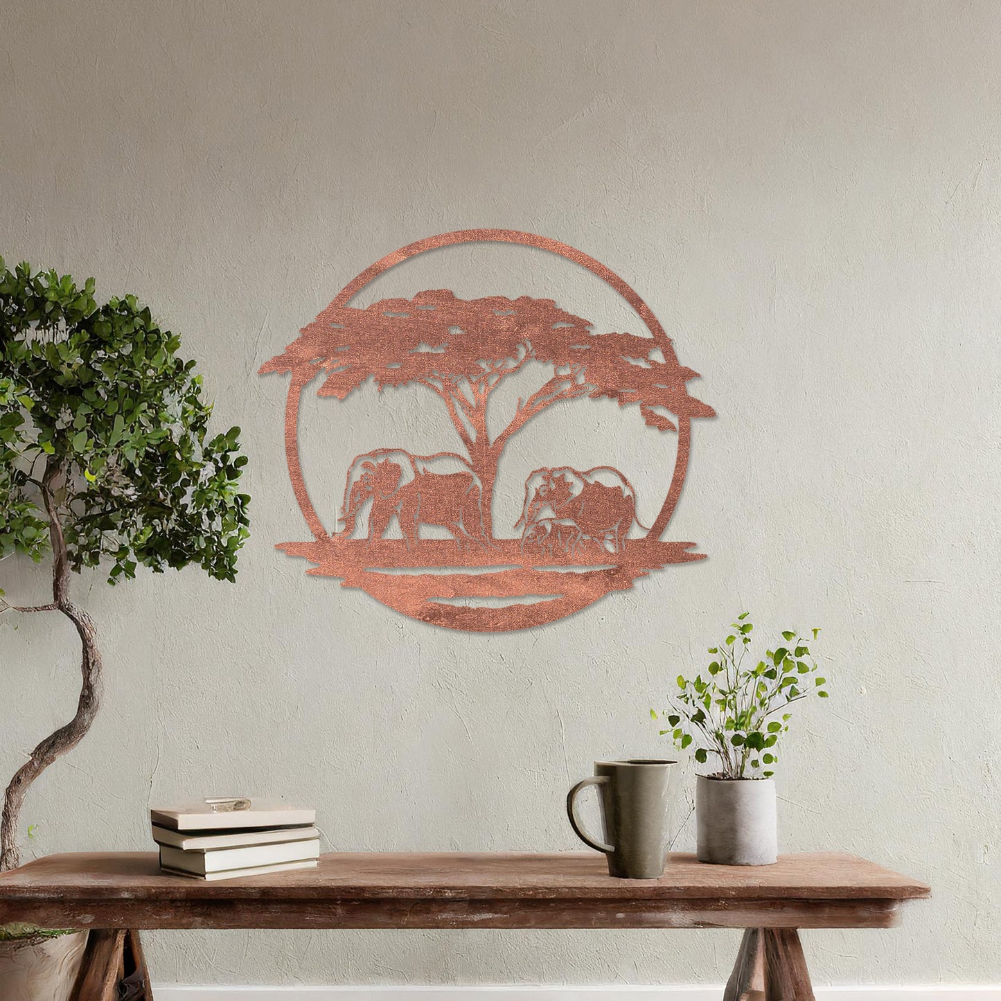Wooden wall art design featuring two elephants under a tree, framed in a circular shape, placed on a neutral wall within modern room decor. The design evokes a sense of tranquility and nature with its detailed depiction of wildlife.
