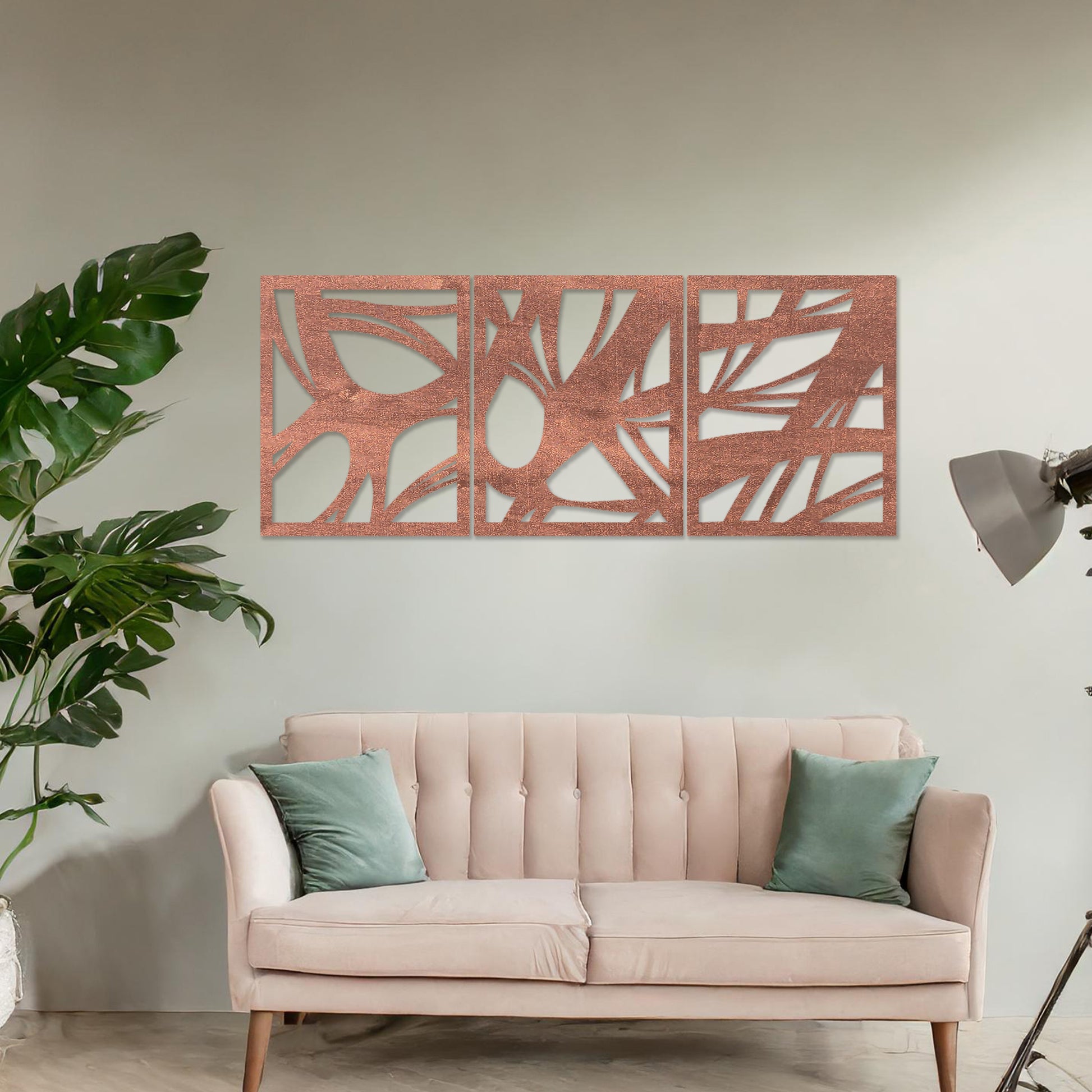 Wooden wall art design featuring a three-panel abstract composition with flowing, organic shapes and cutouts, placed on a neutral wall within modern room decor. The design blends dynamic movement and minimalism for a contemporary look.