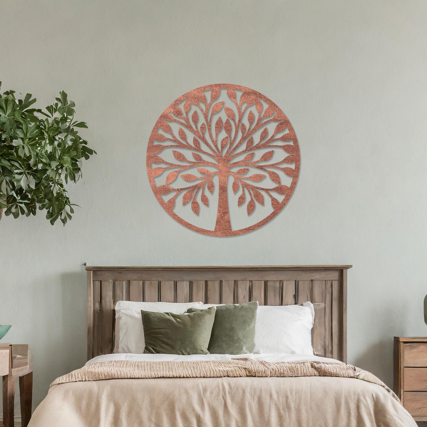 Wooden wall art featuring a circular tree design with stylised leaves and branches, displayed on a neutral wall within modern room decor, highlighting its elegant and nature-inspired craftsmanship.