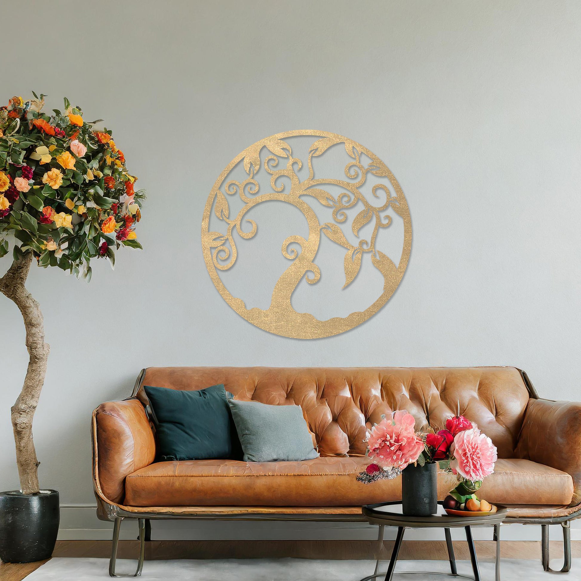 Wooden wall art design featuring a swirling tree with curved branches and leaves, framed in a circular shape, placed on a neutral wall within modern room decor. The design highlights elegant, flowing forms for a peaceful, organic look.