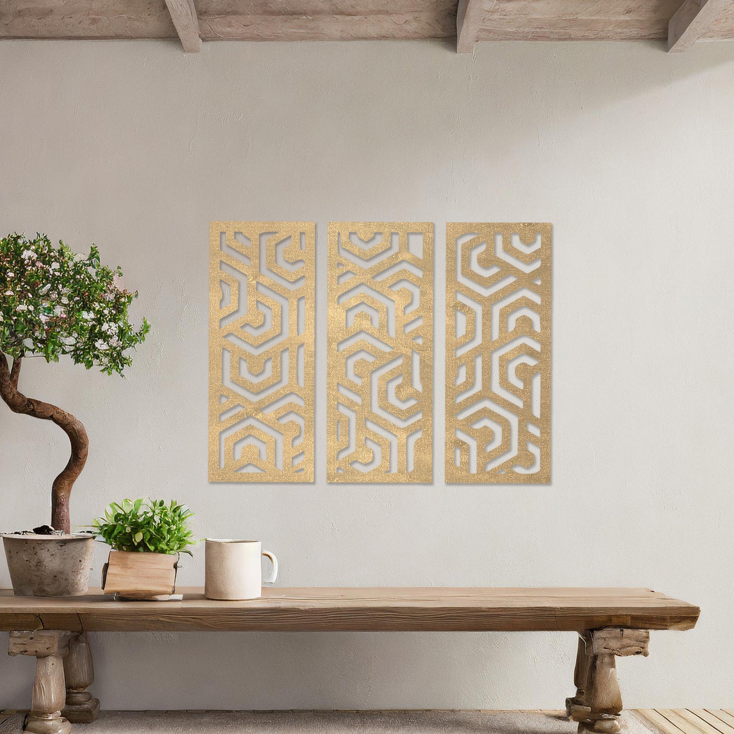 Wooden wall art featuring a three-panel design with intricate geometric patterns. The artwork is displayed on a neutral wall within modern room decor, highlighting its bold and symmetrical design.