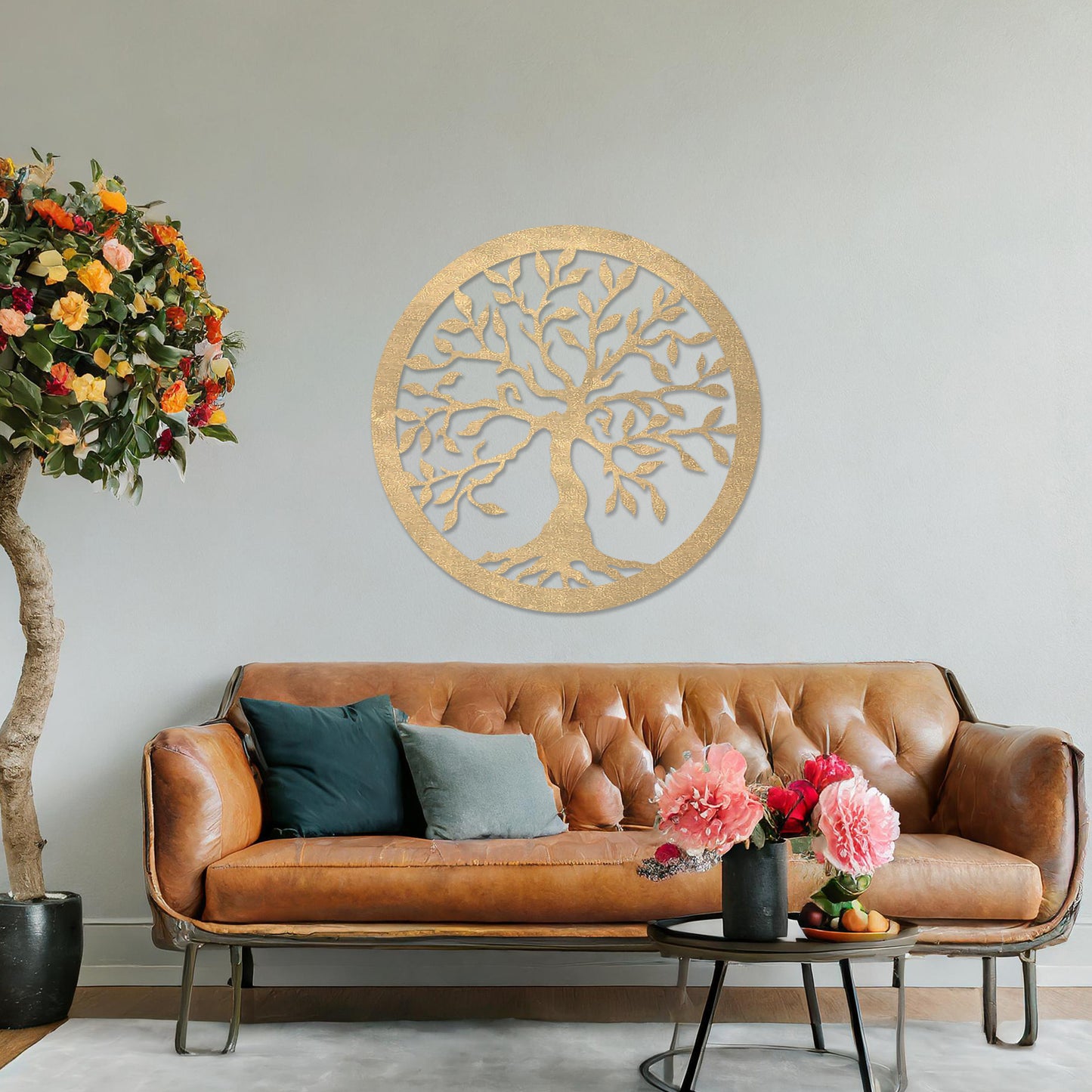 Round wooden wall art featuring an intricately designed tree with sprawling branches and delicate leaves, placed on a neutral wall within a modern setting. The art adds a natural and stylish focal point to the room.