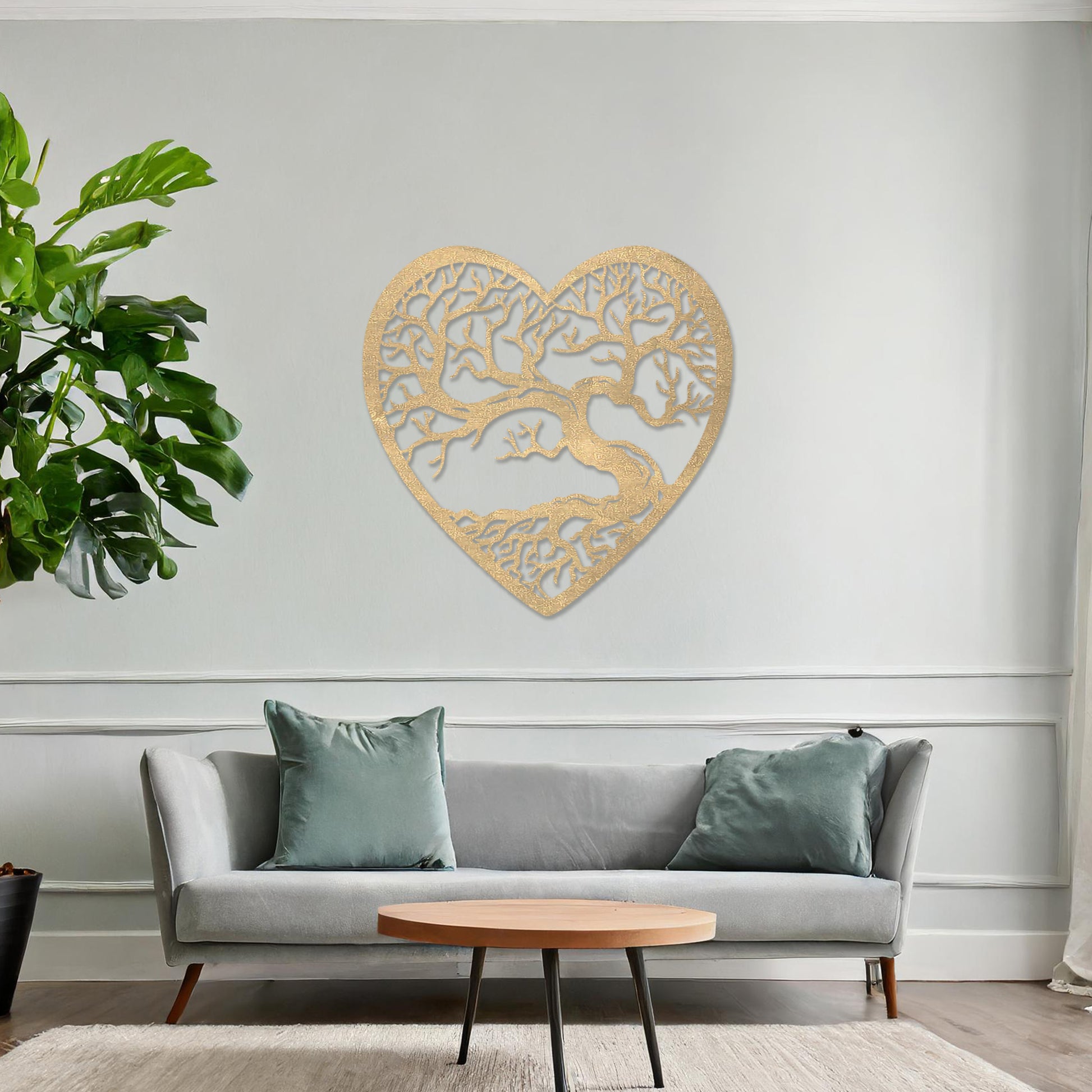 Wooden wall art featuring a heart-shaped design with an intricate tree and branching roots, displayed on a neutral wall within modern room decor, highlighting its natural and artistic craftsmanship.