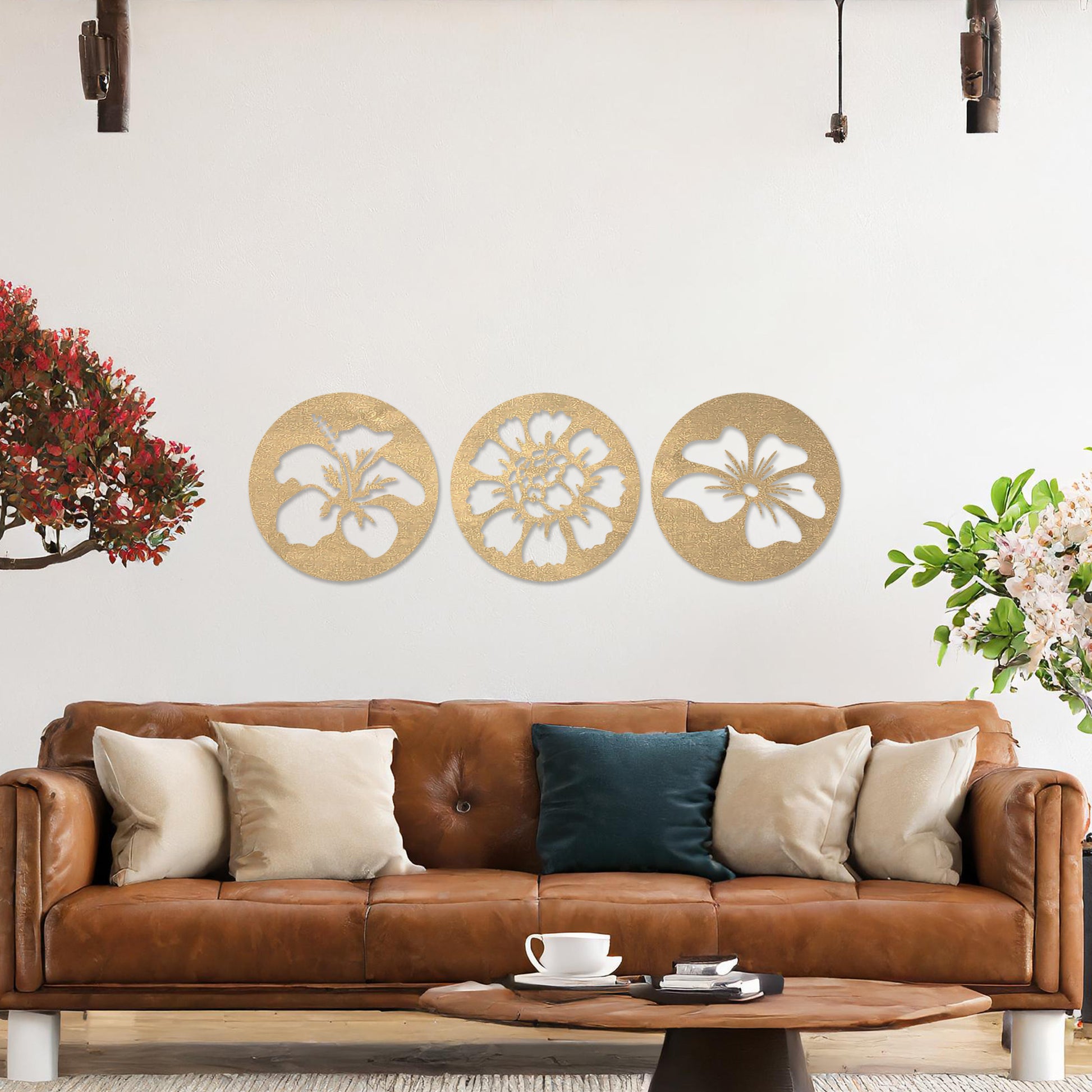 Wall art featuring a set of three circular panels, each showcasing a distinct floral design with intricate cut-out details. The artwork is displayed on a neutral wall within modern decor, adding a charming and decorative touch to the space.