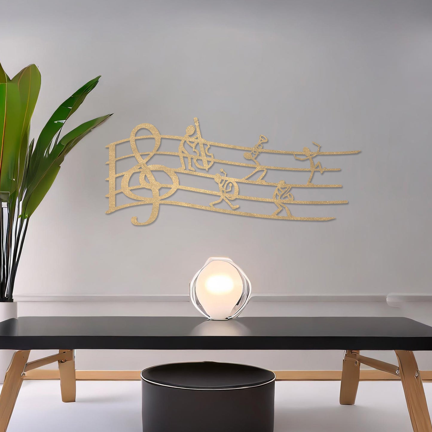 Wall art featuring a creative design of a musical staff with a treble clef and stick figures playing instruments, adding a whimsical and artistic touch. The piece is displayed on a neutral wall within modern decor, enhancing the space with musical charm.