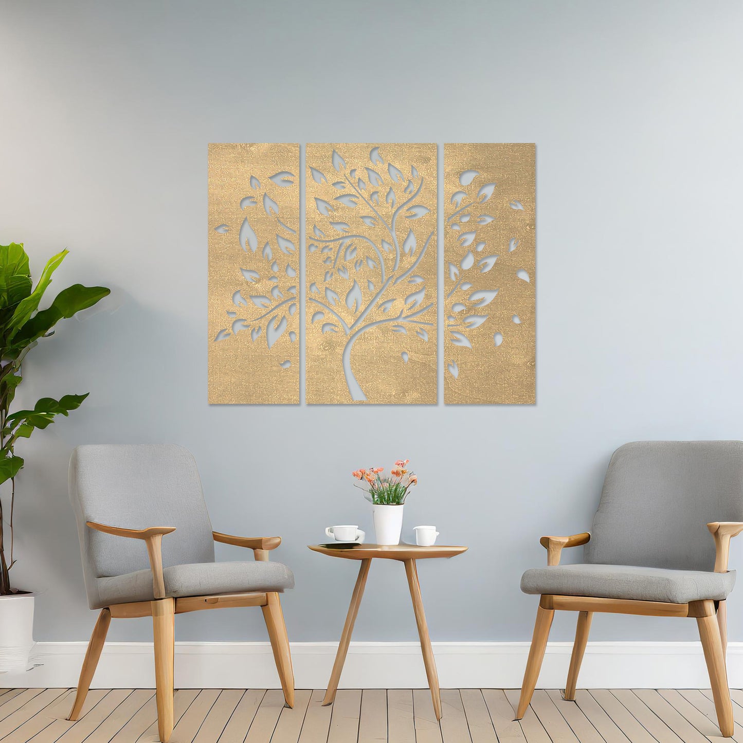 Wooden wall art consisting of three panels featuring a flowing tree design with scattered leaves, displayed on a neutral wall within modern room decor, emphasising its elegant and natural aesthetic.