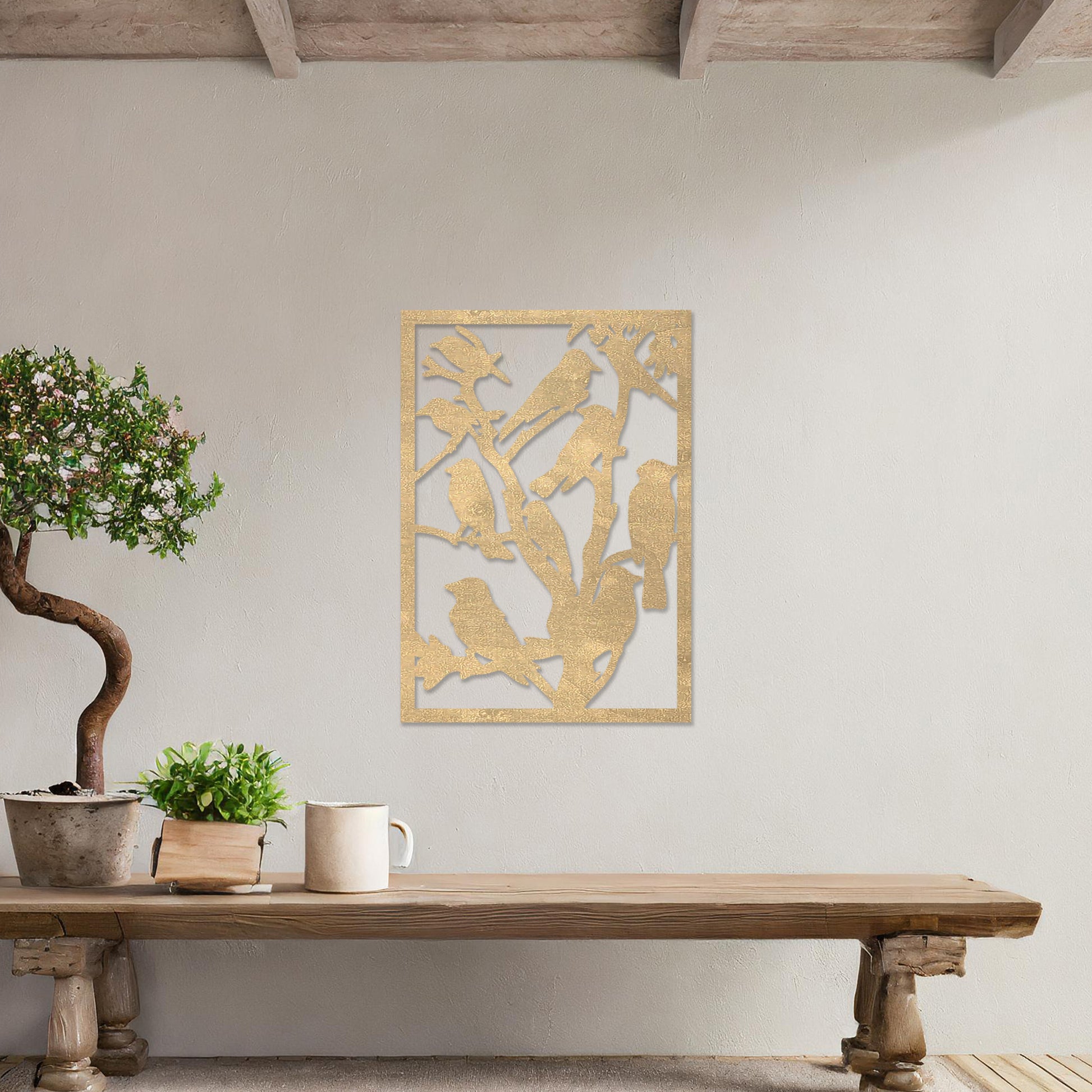Wooden wall art featuring a detailed design of birds perched on branches. The artwork is displayed on a neutral wall within modern room decor, highlighting the intricate natural pattern.