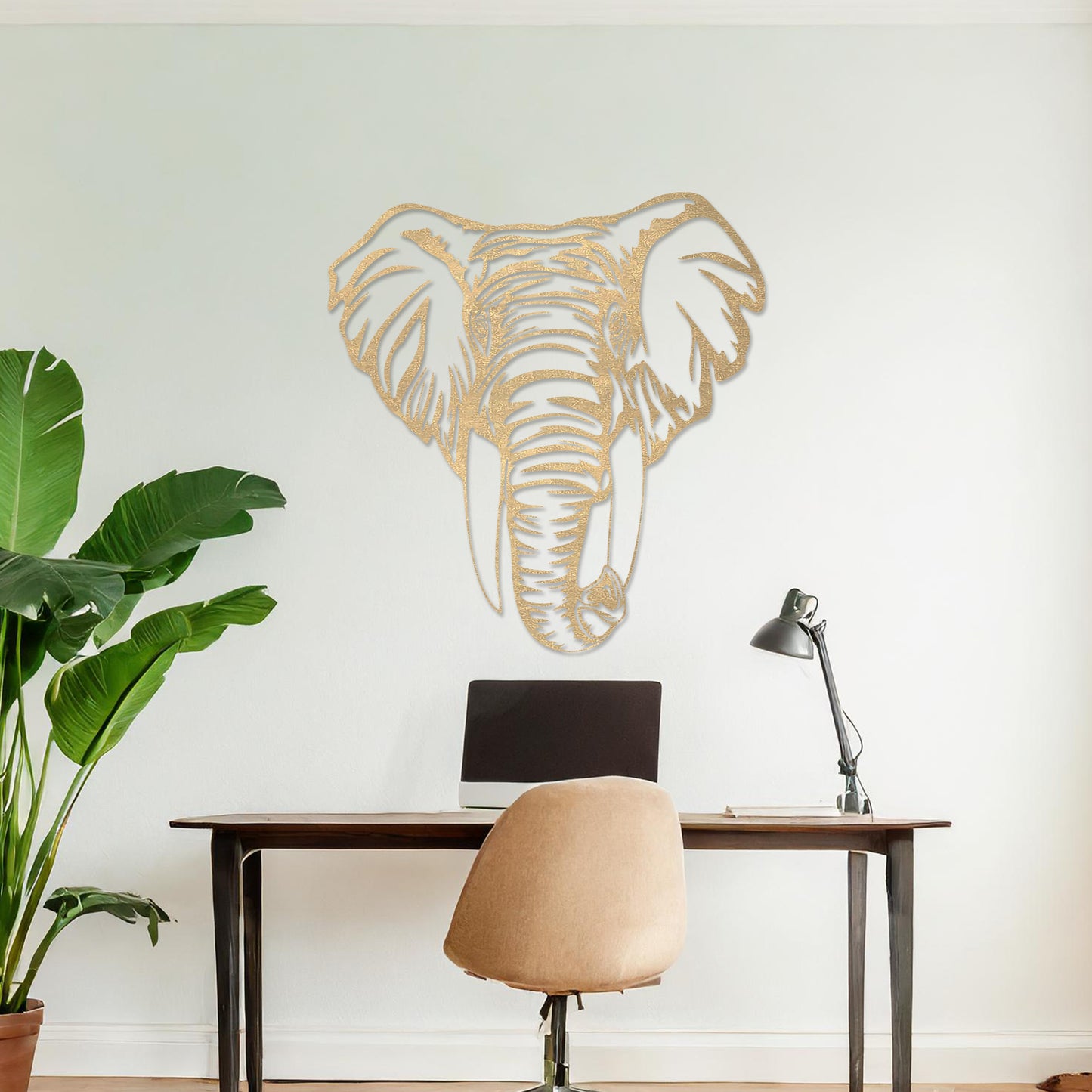 Wooden wall art featuring an intricately detailed elephant head design, displayed on a neutral wall within modern room decor, highlighting its bold and artistic craftsmanship.