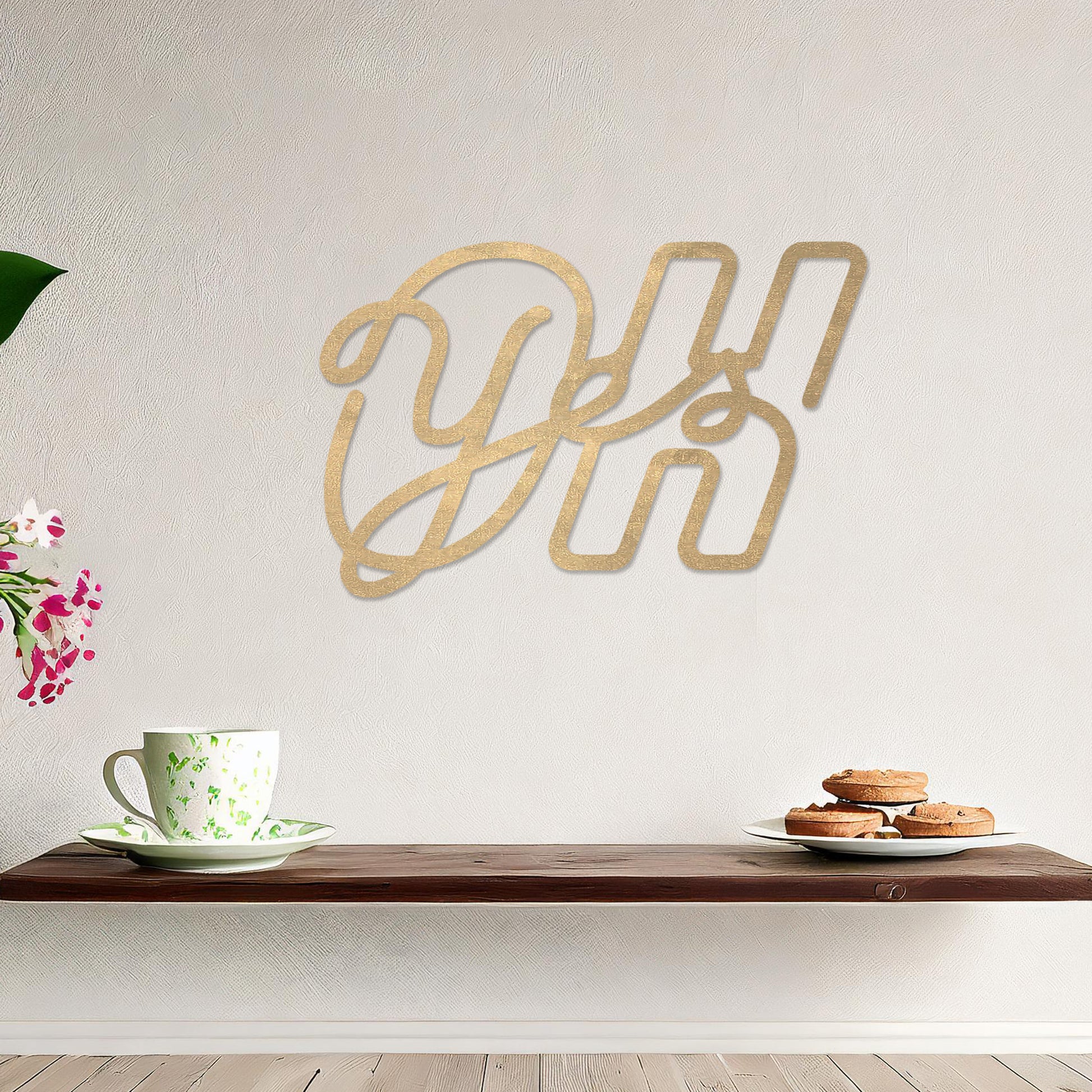 Wall art featuring the phrase "Oh Yes" in an elegant, flowing script combined with bold, block-style letters. The piece is displayed on a neutral wall within modern decor, adding a creative and playful touch to the space.