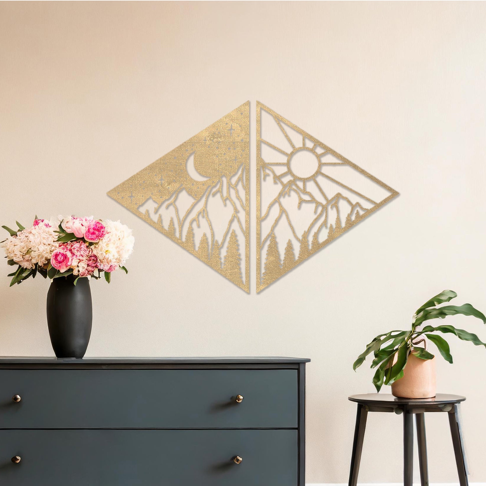 Wooden wall art design featuring a diamond-shaped composition split into two panels: one with a crescent moon and stars over mountains, and the other with a sun above the same landscape, placed on a neutral wall within modern room decor. 