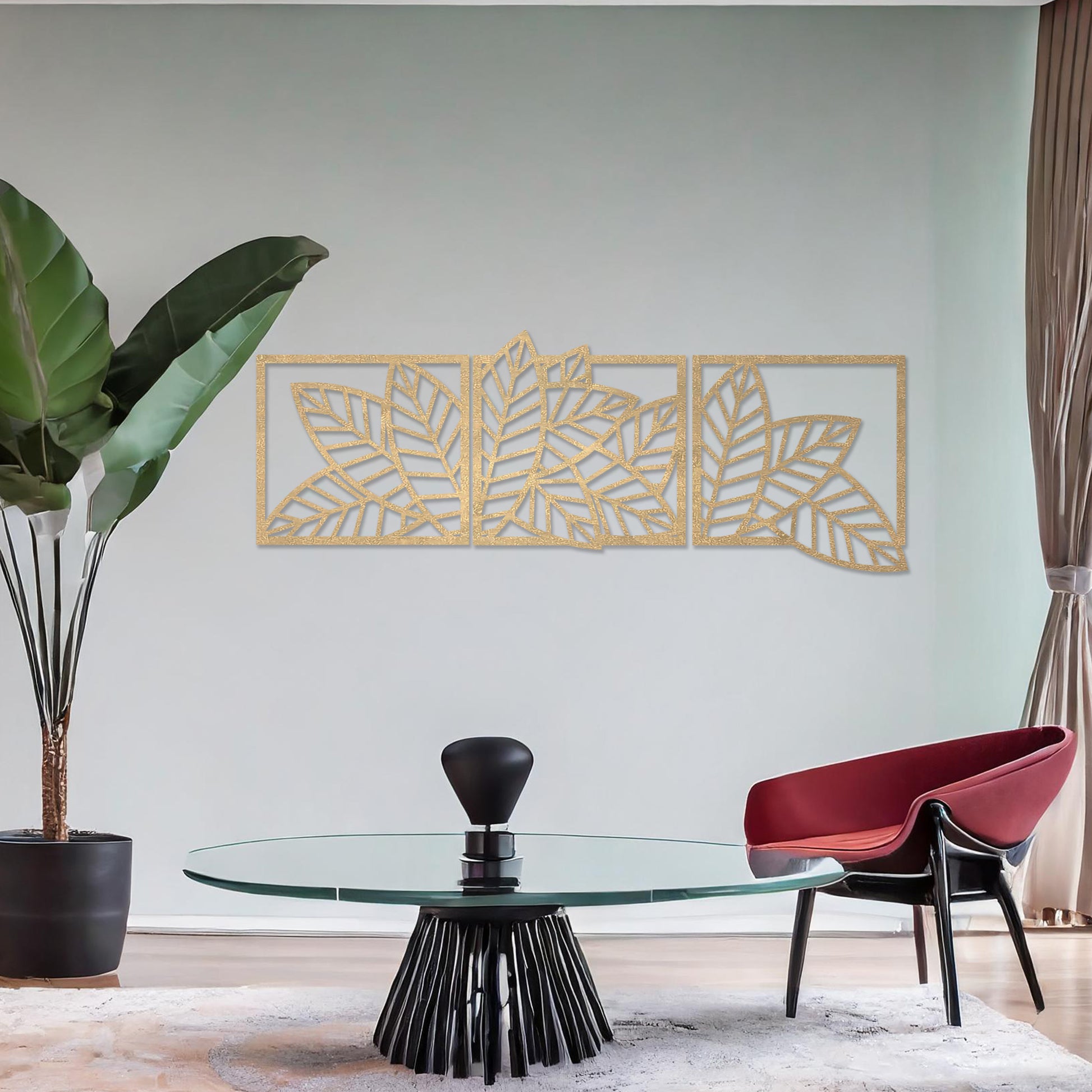 Wooden wall art featuring a three-panel design of overlapping leaf patterns with intricate cut-outs. The artwork is displayed on a neutral wall within modern room decor, highlighting its natural and elegant design.