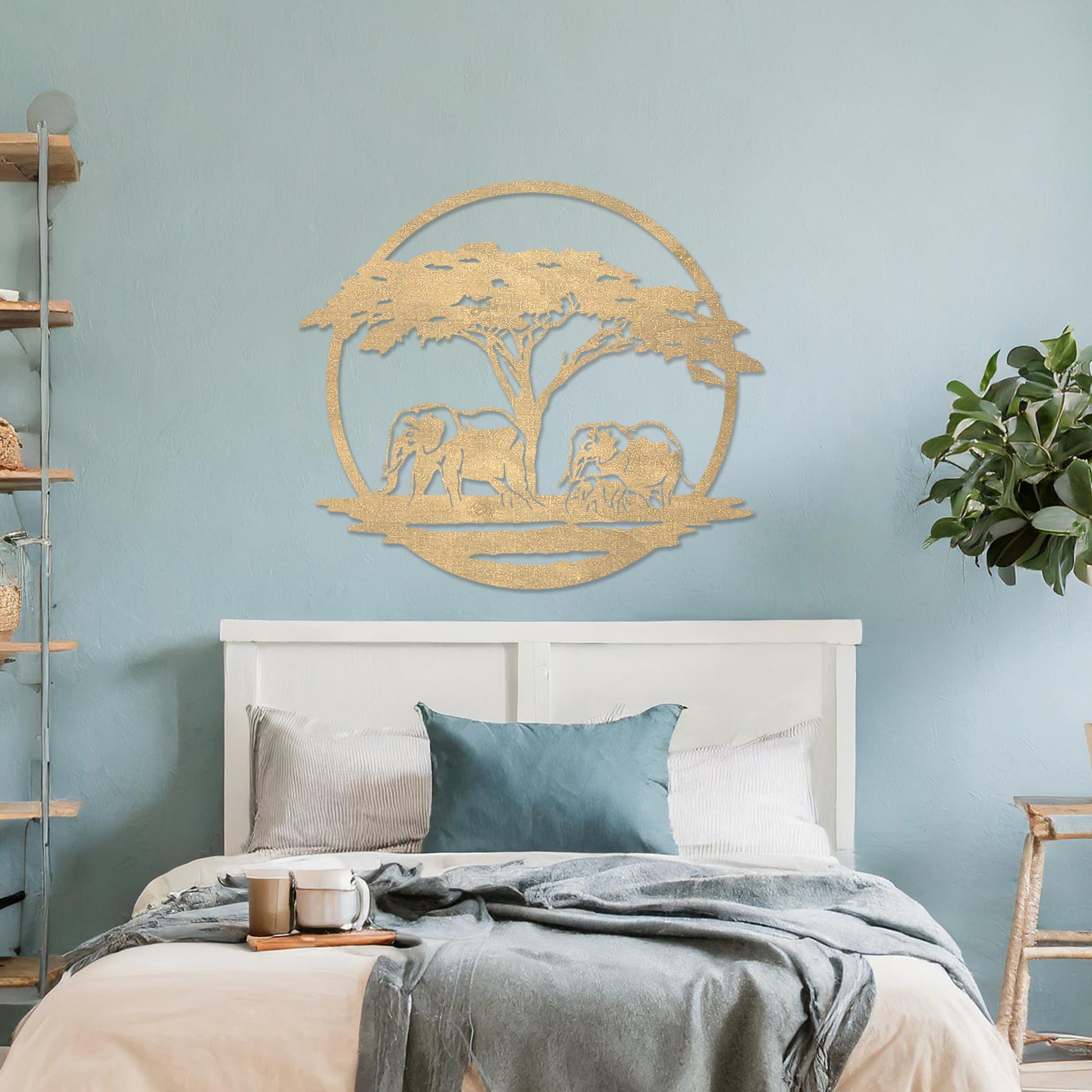 Wooden wall art design featuring two elephants under a tree, framed in a circular shape, placed on a neutral wall within modern room decor. The design evokes a sense of tranquility and nature with its detailed depiction of wildlife.