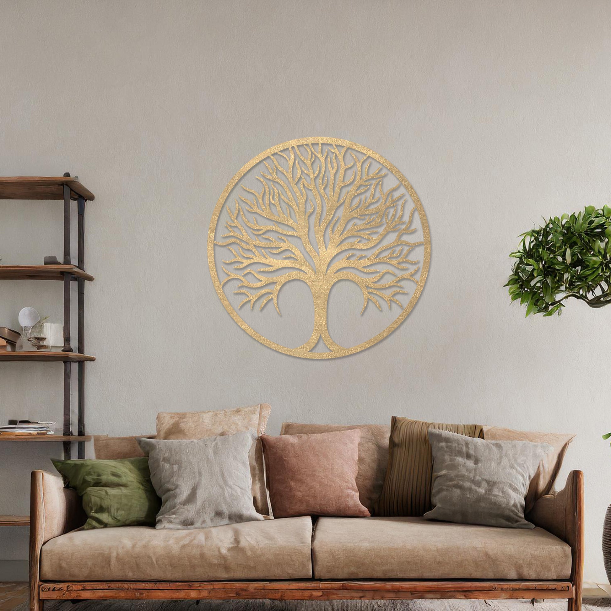 Circular wall art featuring a detailed tree design with spreading branches, symbolising life and growth. This piece is displayed on a neutral wall in a modern room, complementing the elegant and contemporary decor.