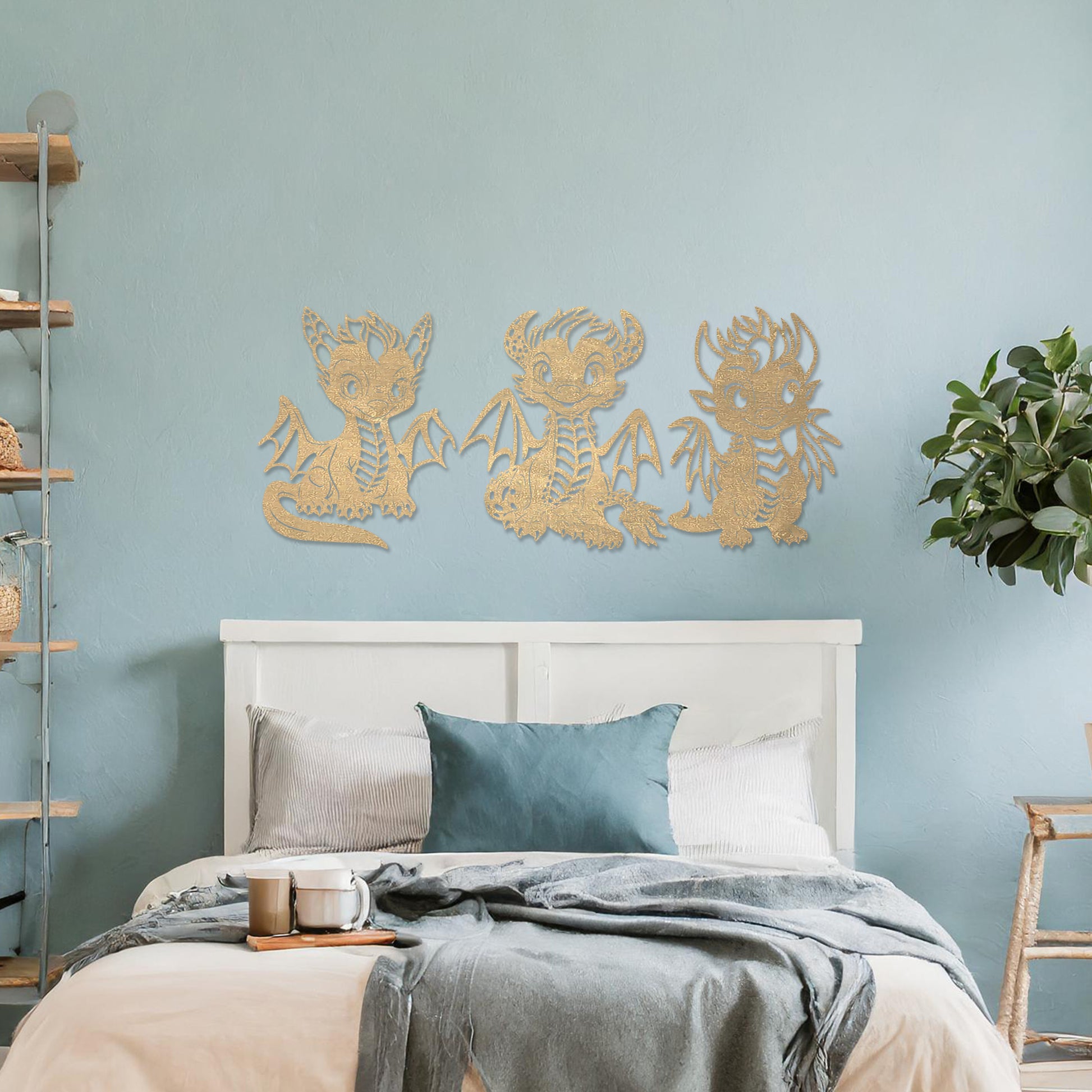 Wooden wall art design featuring three playful dragon characters, each with different poses and expressions, placed on a neutral wall within modern room decor. The design brings whimsy and charm with detailed features and lively energy.