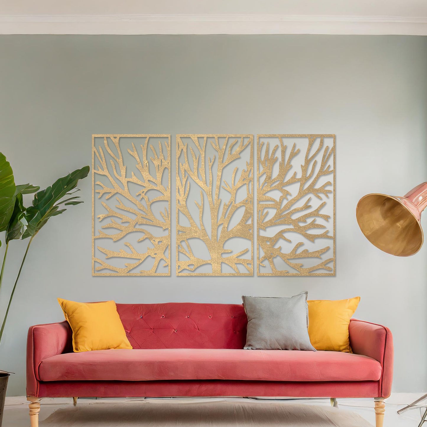 Wall art featuring an intricate tree branch design split into three panels. The piece is displayed on a neutral wall within modern room decor, complementing the surrounding contemporary setting.