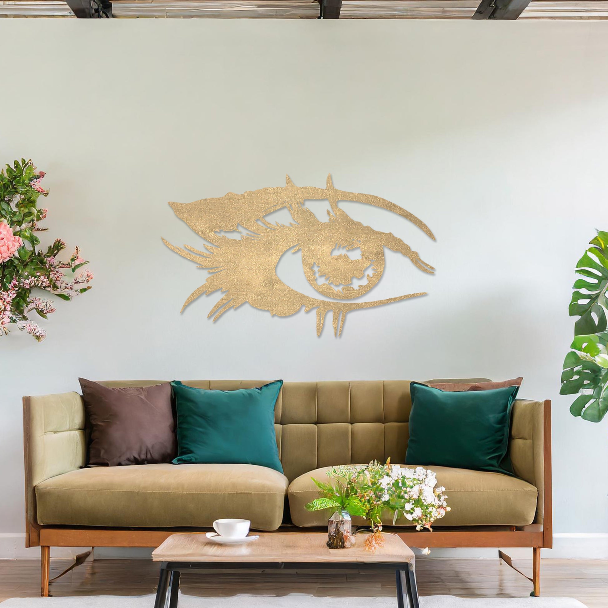 Wooden wall art featuring a stylised eye design with intricate detailing of lashes and bold lines. The artwork is displayed on a neutral wall within modern room decor, emphasising its artistic and striking pattern.
