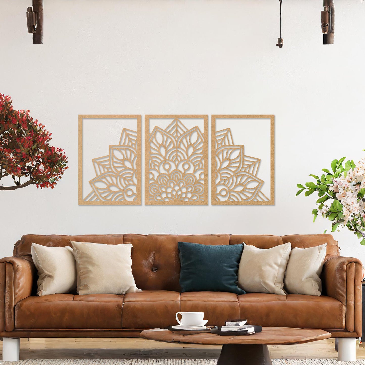 Wall art featuring a triptych design with an intricate mandala pattern spread across three panels. The artwork is displayed on a neutral wall within modern room decor, adding a harmonious and decorative touch to the setting.