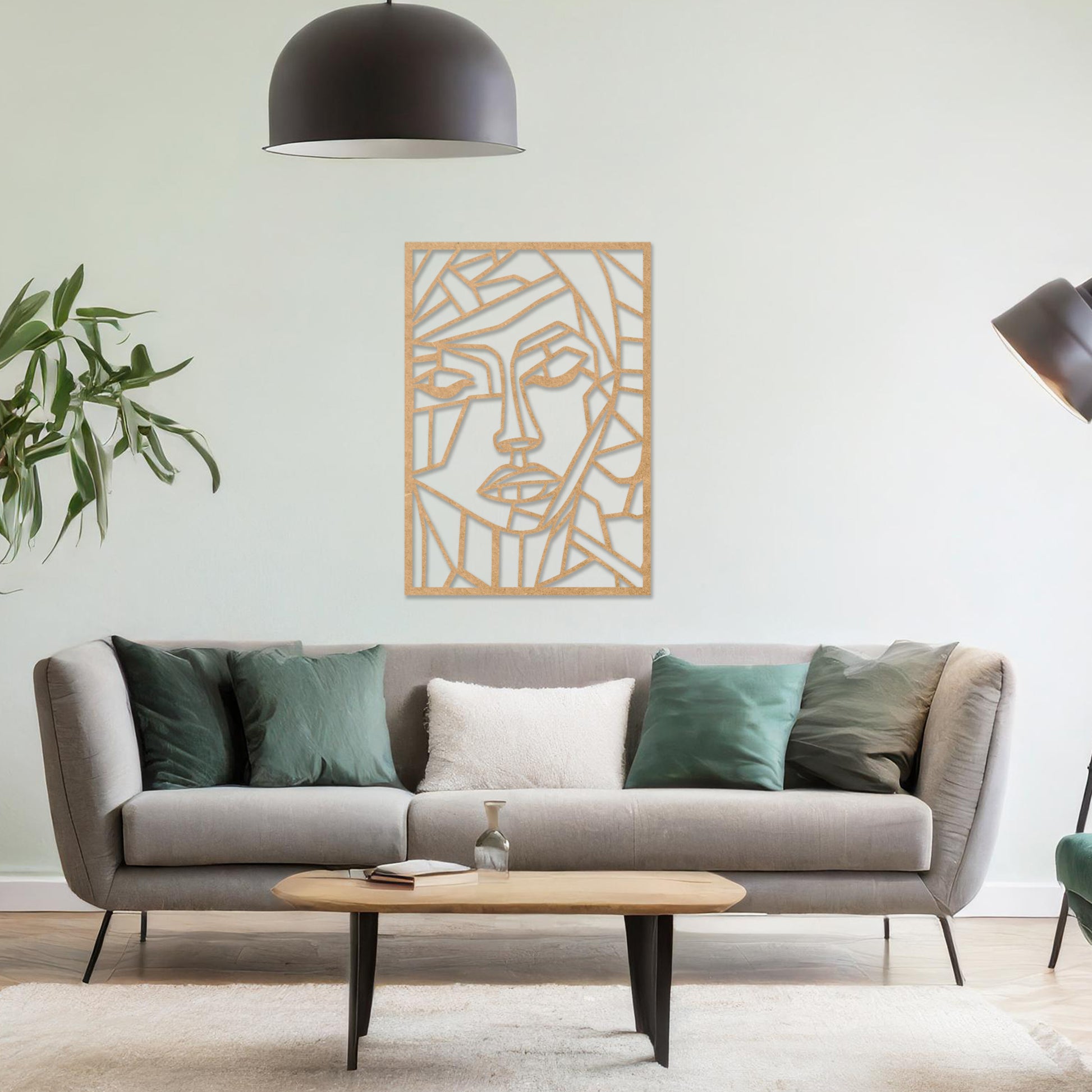A rectangular wall art piece featuring an abstract face design composed of geometric shapes and clean lines. The artwork is displayed on a neutral wall in a contemporary living room, 