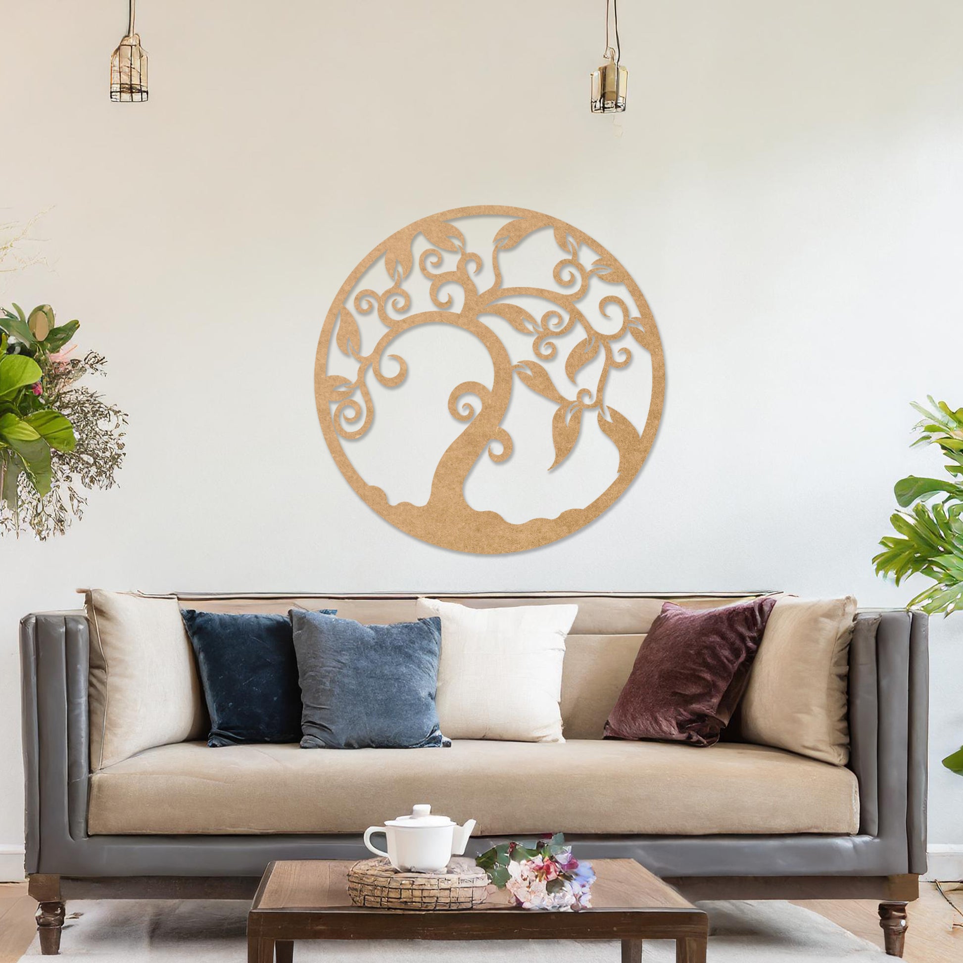 Wooden wall art design featuring a swirling tree with curved branches and leaves, framed in a circular shape, placed on a neutral wall within modern room decor. The design highlights elegant, flowing forms for a peaceful, organic look.