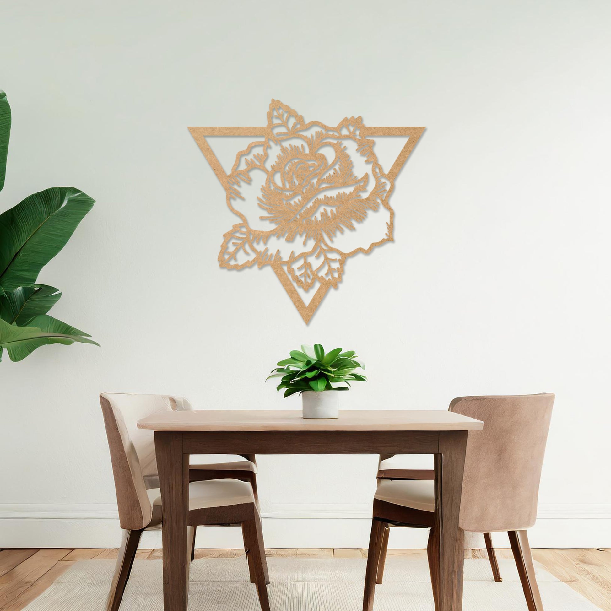Wooden wall art featuring a rose design framed within a triangular outline, showcasing intricate detailing of petals and leaves. The artwork is displayed on a neutral wall within modern room decor, highlighting its elegant and bold aesthetic.