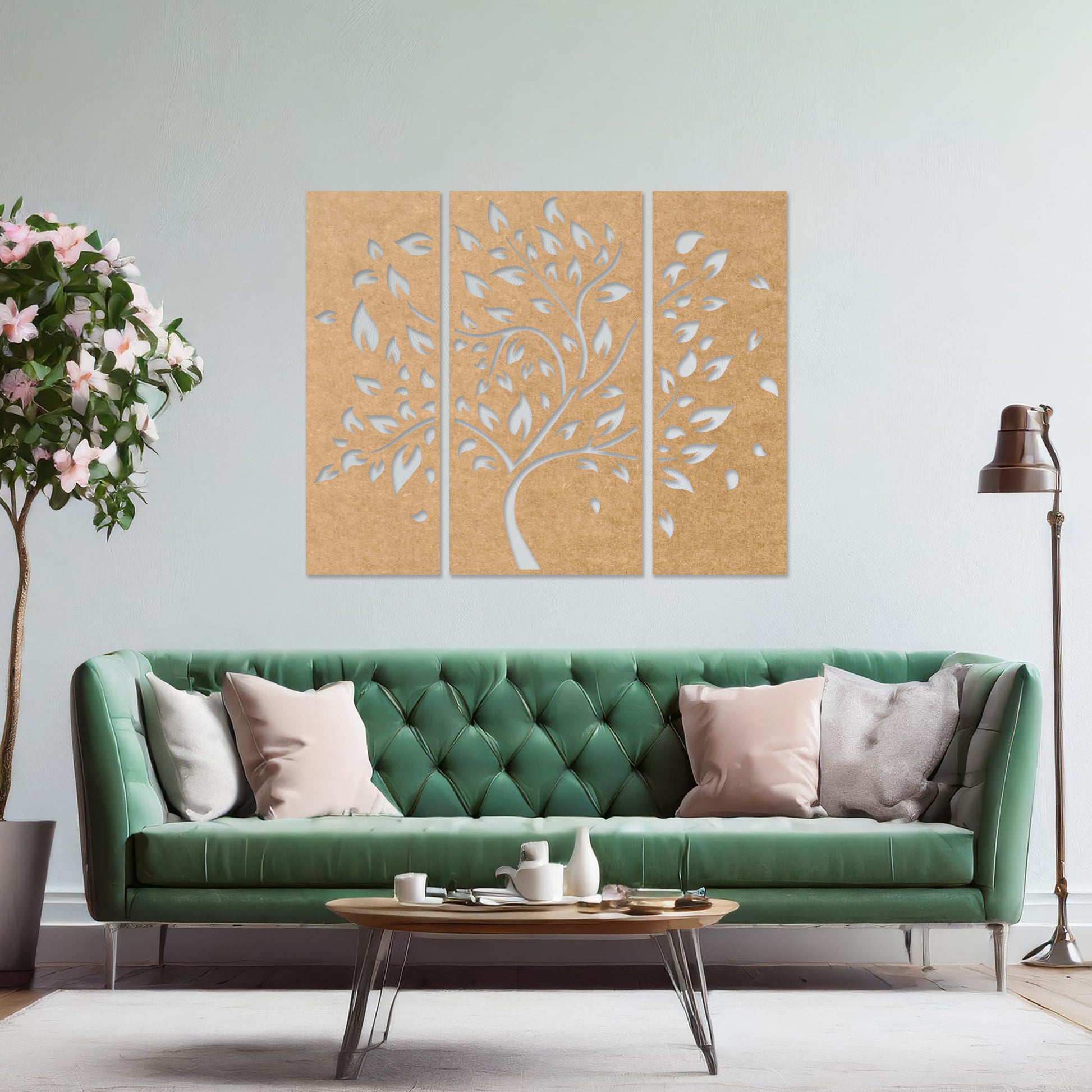 Wooden wall art consisting of three panels featuring a flowing tree design with scattered leaves, displayed on a neutral wall within modern room decor, emphasising its elegant and natural aesthetic.