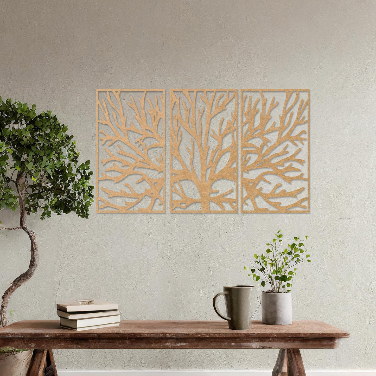 Wall art featuring an intricate tree branch design split into three panels. The piece is displayed on a neutral wall within modern room decor, complementing the surrounding contemporary setting.