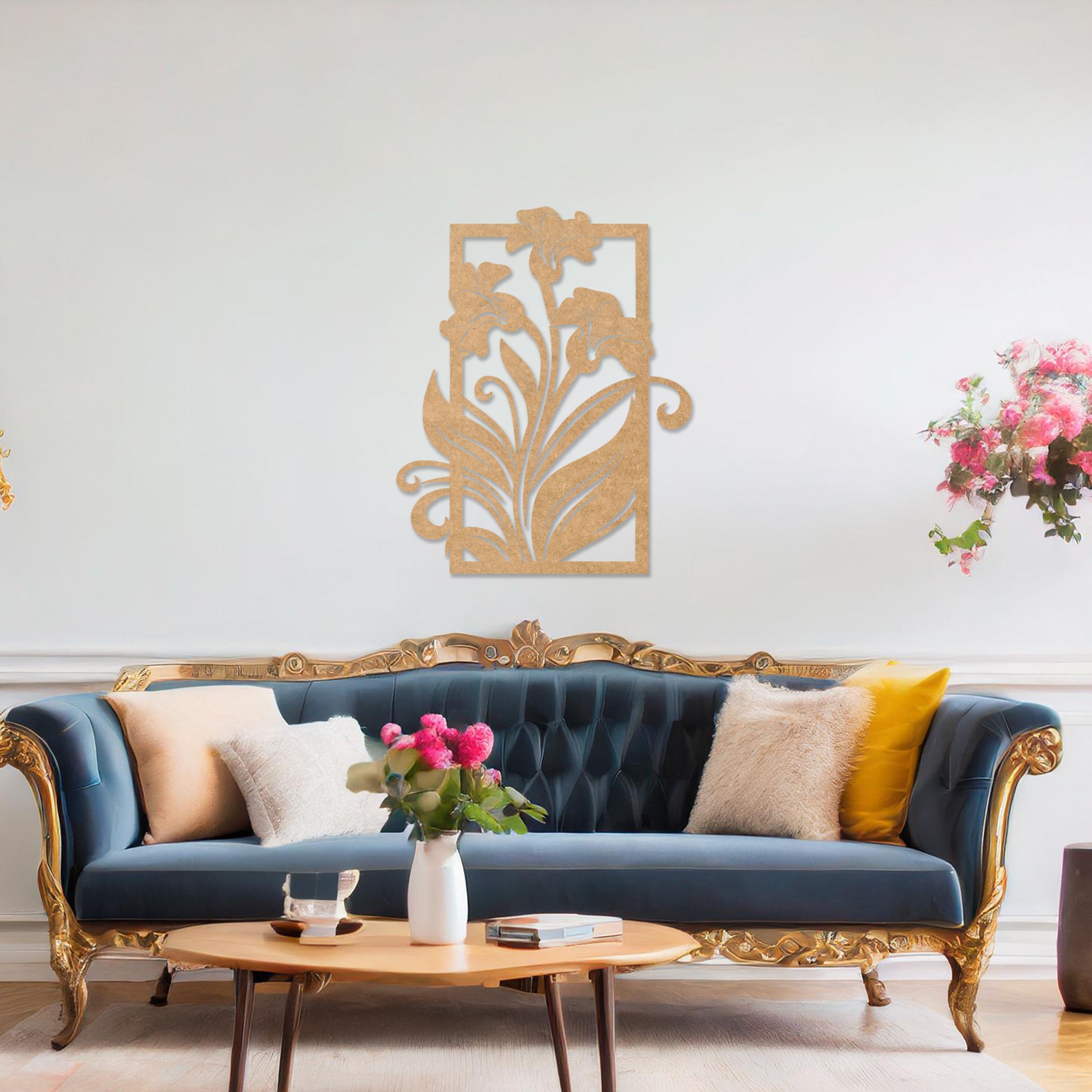 Wall art featuring an elegant floral design with three blooming lilies and flowing leaves enclosed in a rectangular frame. The piece is displayed on a neutral wall within modern room decor, adding a graceful and artistic touch to the setting.