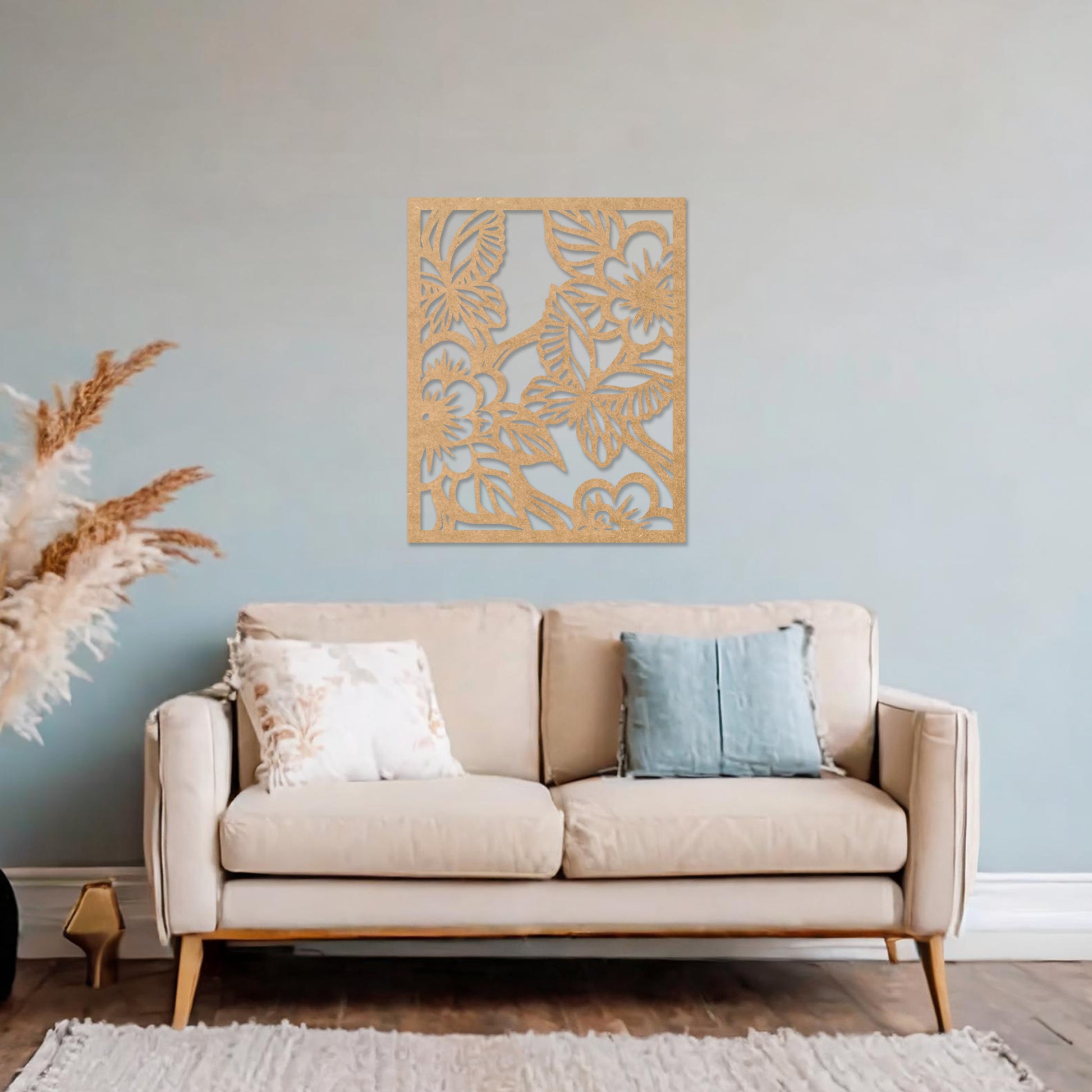 Wooden wall art featuring a square design with intricate floral and leaf patterns, showcasing a vibrant natural theme. The artwork is displayed on a neutral wall within modern room decor, highlighting its artistic and elegant appeal.