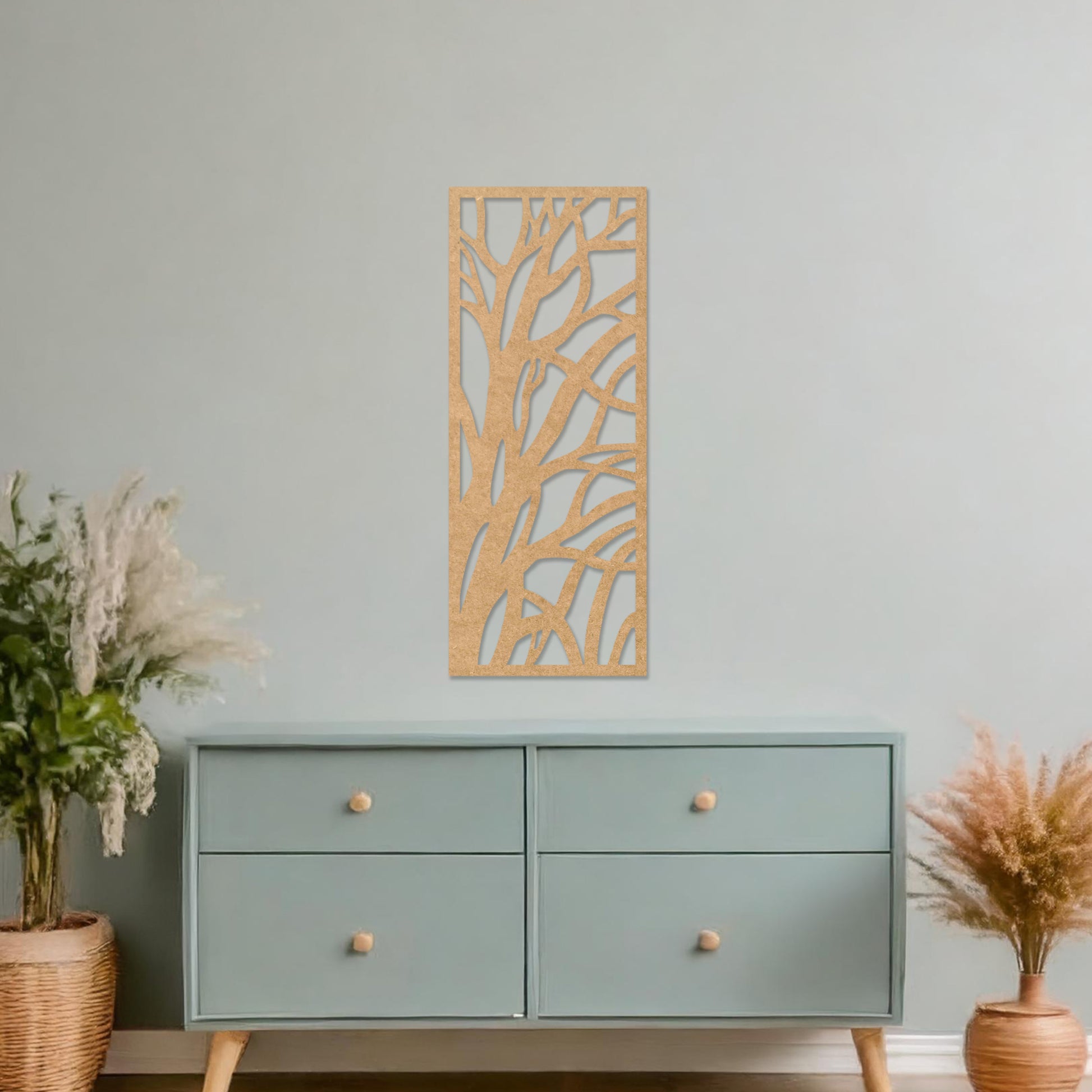 Wooden wall art featuring a rectangular design with an abstract tree branch pattern. The artwork is displayed on a neutral wall within modern room decor, emphasising its minimalist and natural aesthetic.