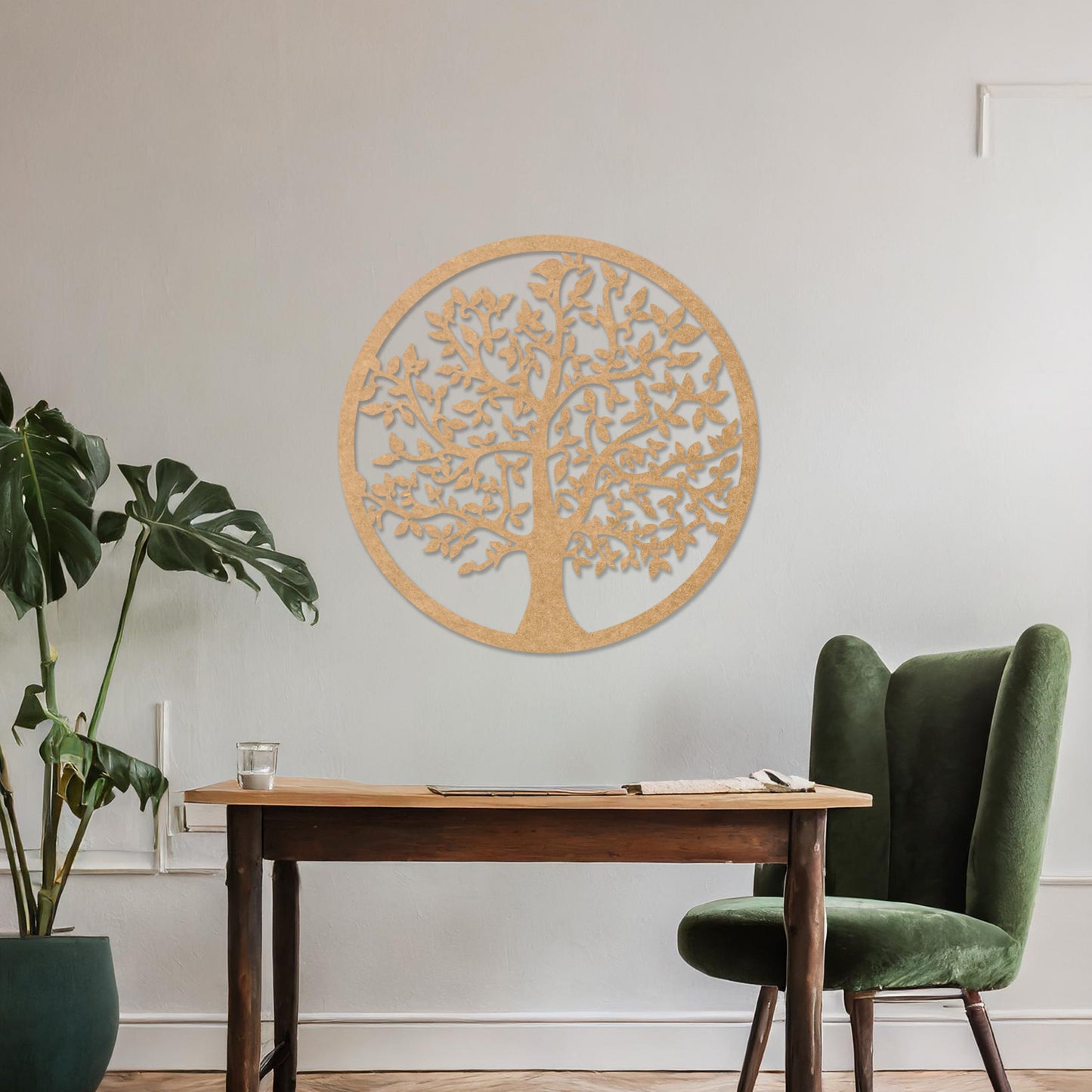 Wooden wall art featuring a circular design with an intricately detailed tree of life motif. The artwork is displayed on a neutral wall within modern room decor, highlighting its symbolic and artistic appeal.