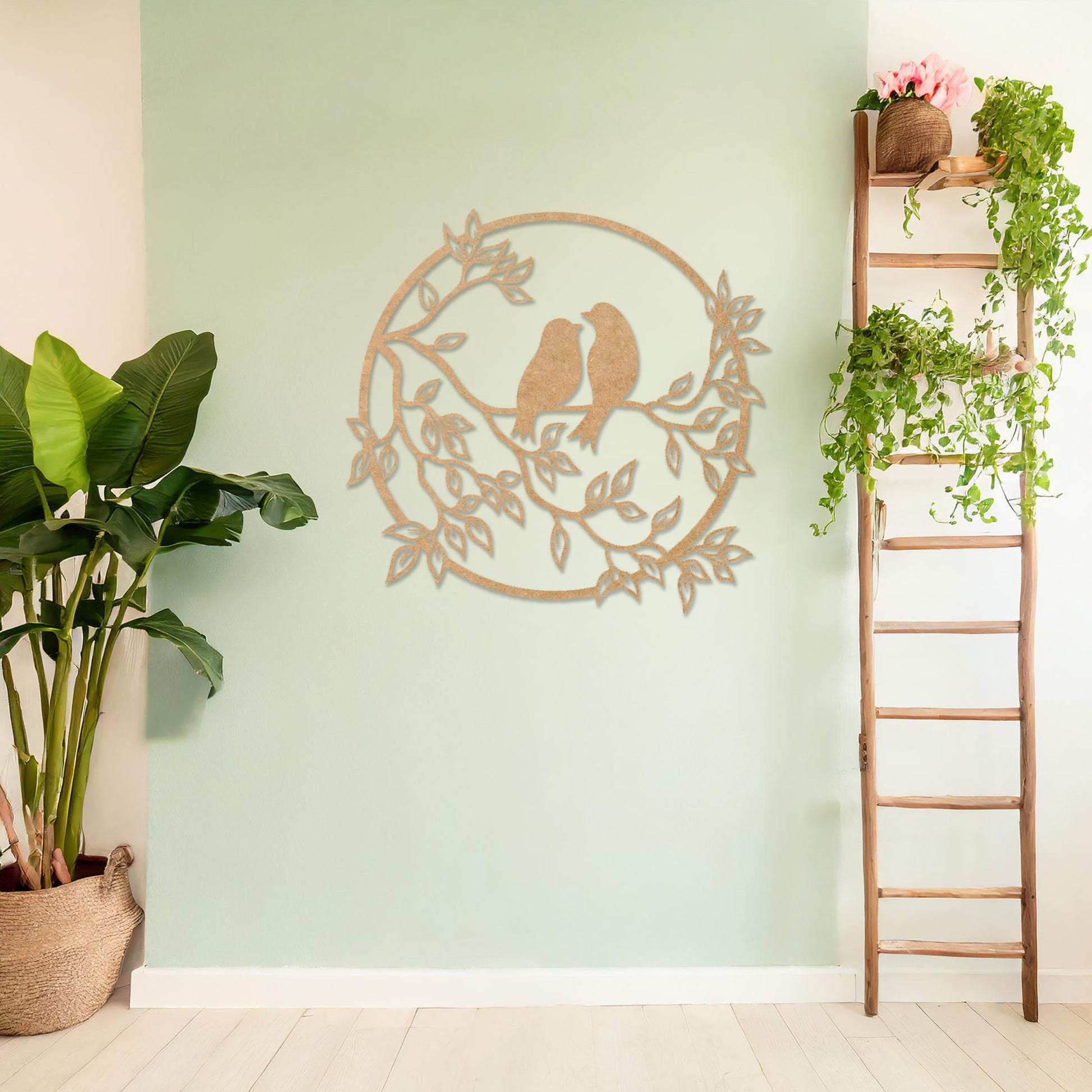 Wooden wall art featuring a circular design with two birds perched on a branch surrounded by leaves, displayed on a neutral wall within modern room decor, showcasing its delicate and nature-inspired craftsmanship.