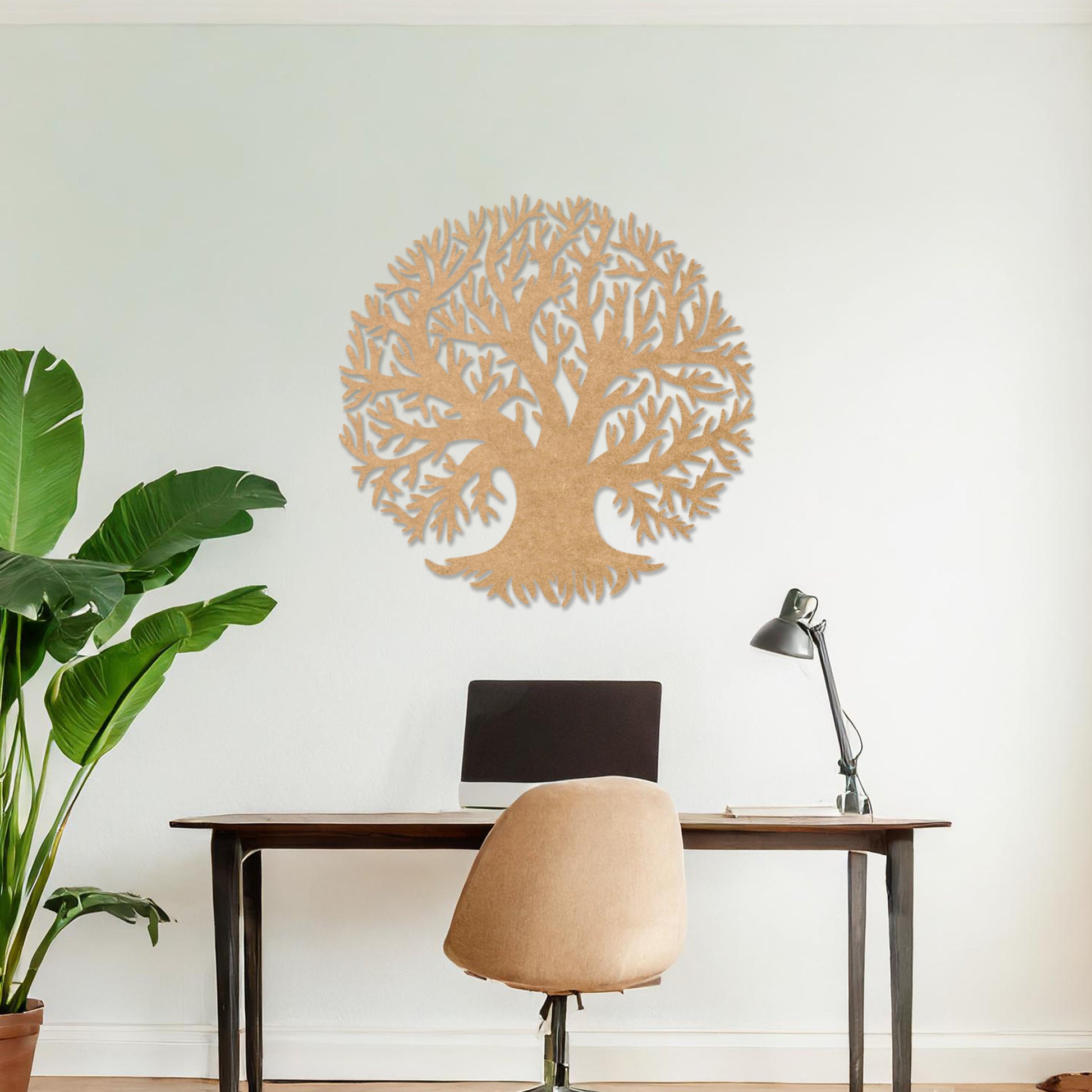 Wooden wall art featuring a circular tree design with detailed branches, displayed on a neutral wall within modern room decor, emphasising its intricate craftsmanship and natural theme.