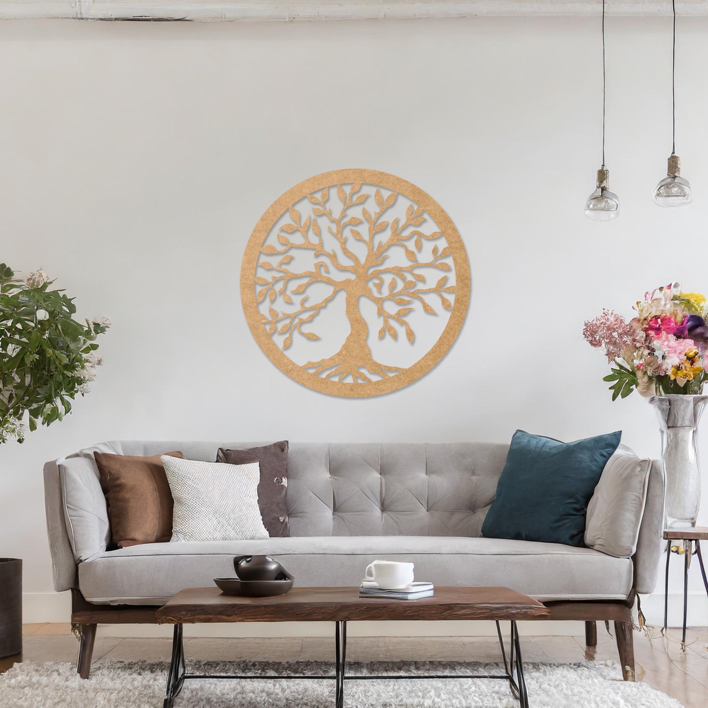 Round wooden wall art featuring an intricately designed tree with sprawling branches and delicate leaves, placed on a neutral wall within a modern setting. The art adds a natural and stylish focal point to the room.