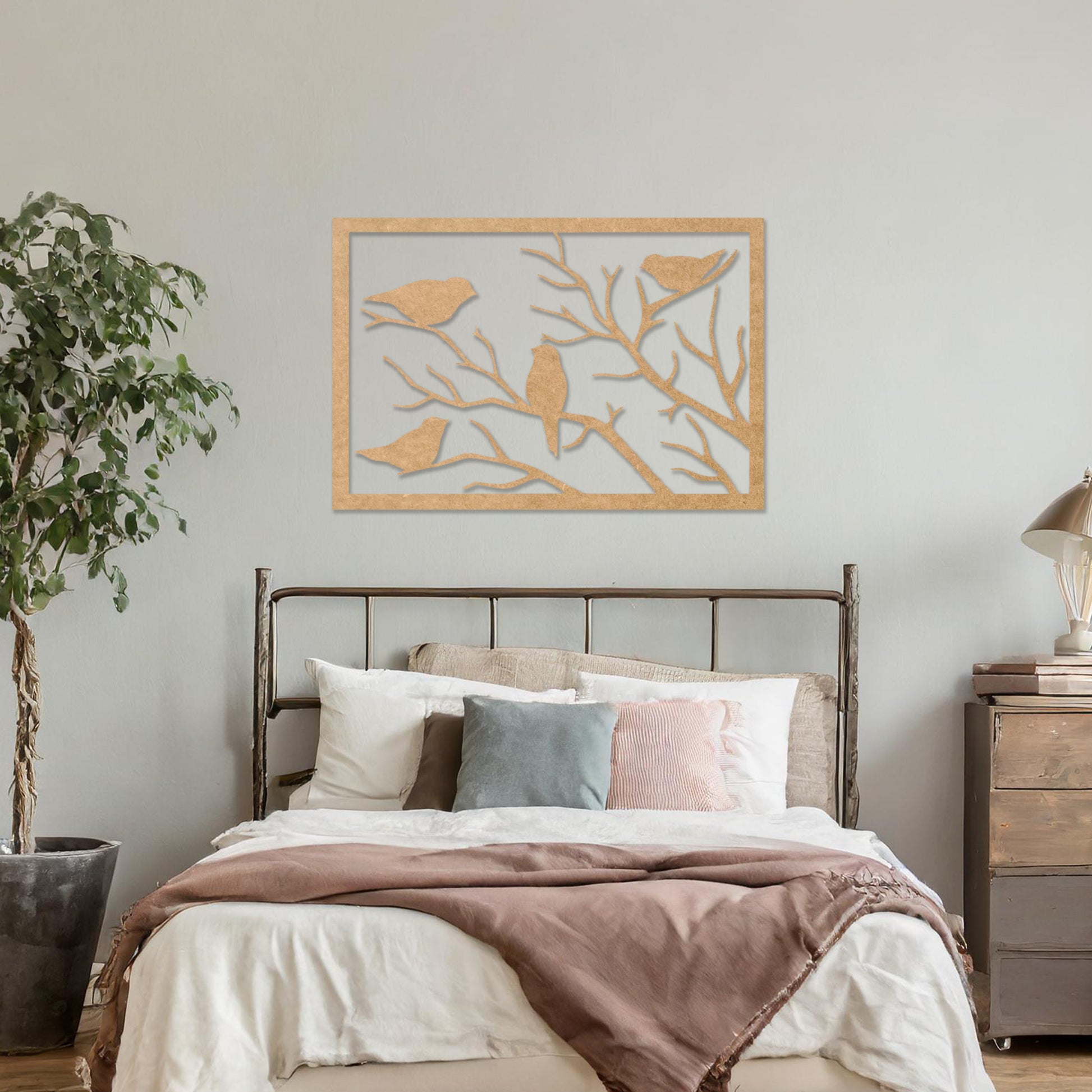 Wooden wall art featuring a rectangular design with birds perched on tree branches, displayed on a neutral wall within modern room decor, highlighting its elegant and nature-inspired craftsmanship.
