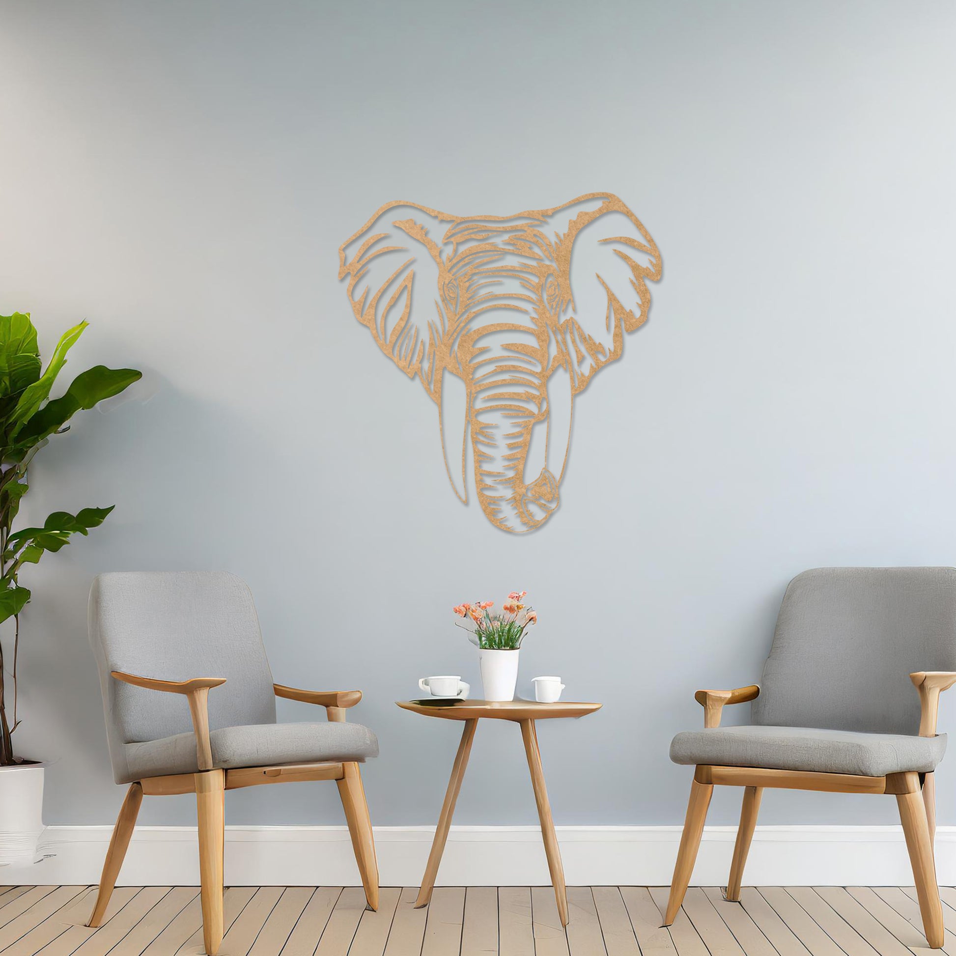 Wooden wall art featuring an intricately detailed elephant head design, displayed on a neutral wall within modern room decor, highlighting its bold and artistic craftsmanship.