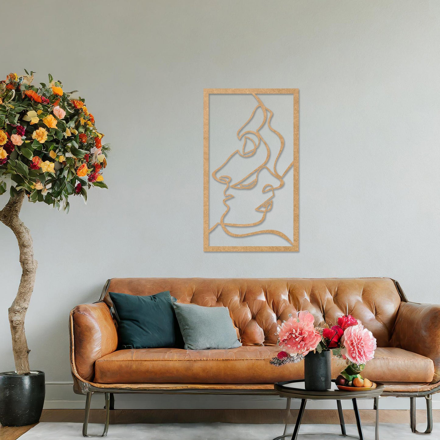 Wooden wall art design featuring abstract line art of two faces, placed on a neutral wall with modern room decor. The design is minimalistic and elegant, capturing human forms through flowing lines.