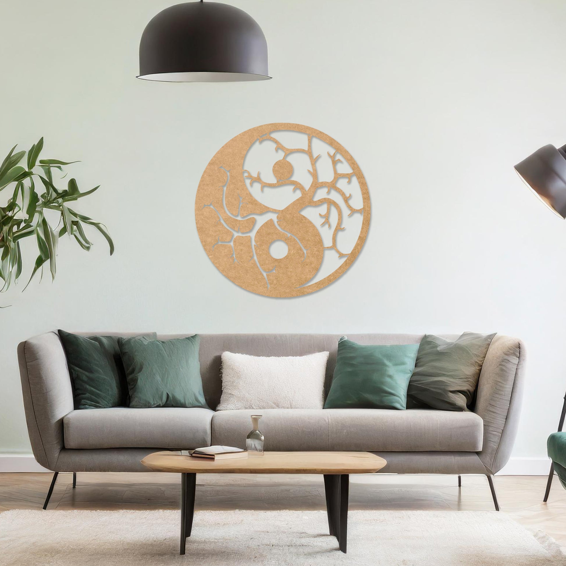 Wall art featuring a yin-yang design with tree branches integrated into each half, symbolising balance and harmony. The piece is displayed on a neutral wall within modern decor, adding a meaningful and artistic focal point to the space.