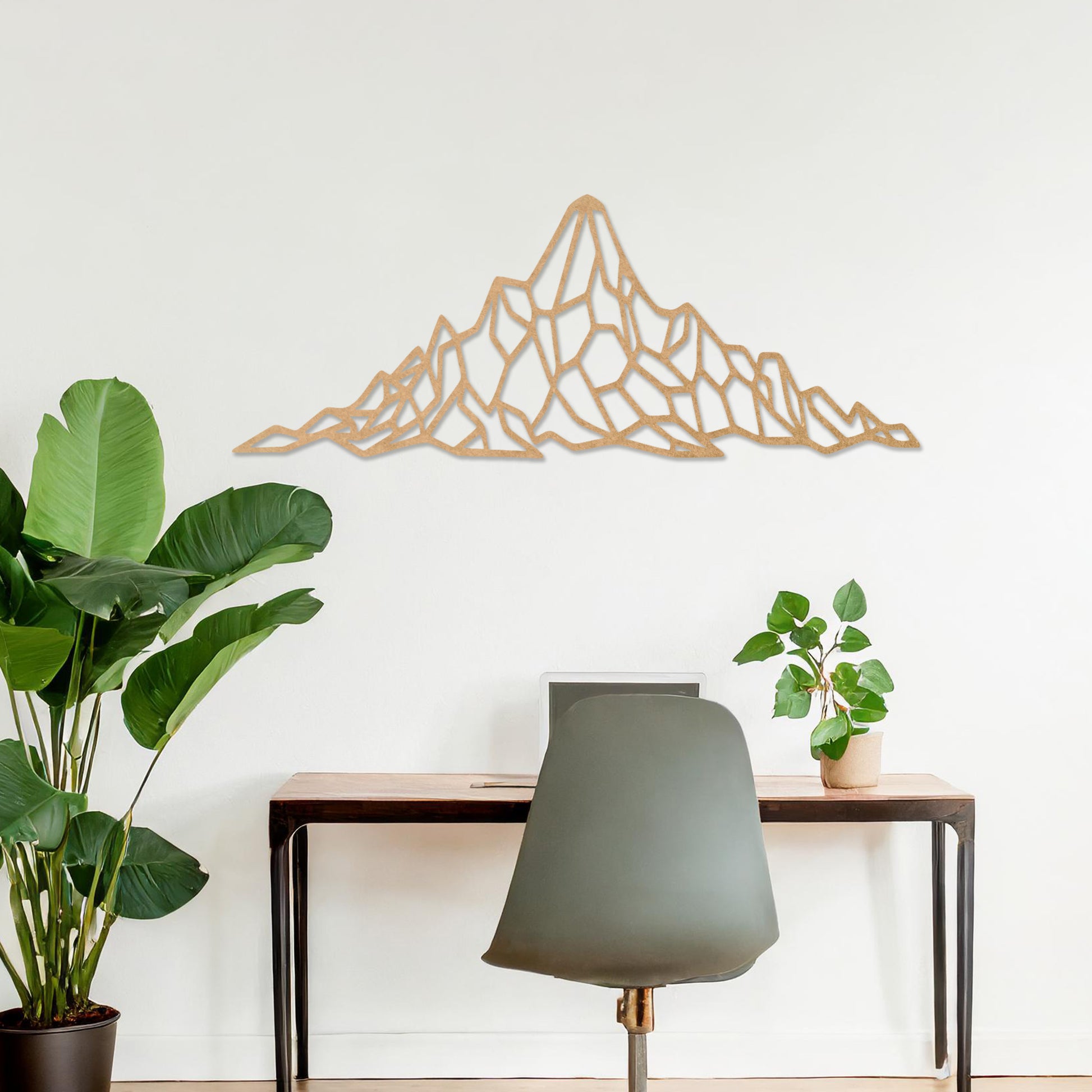 Wooden wall art featuring a geometric mountain range design with angular, interconnected shapes. The artwork is displayed on a neutral wall within modern room decor, emphasising its bold and minimalist aesthetic.