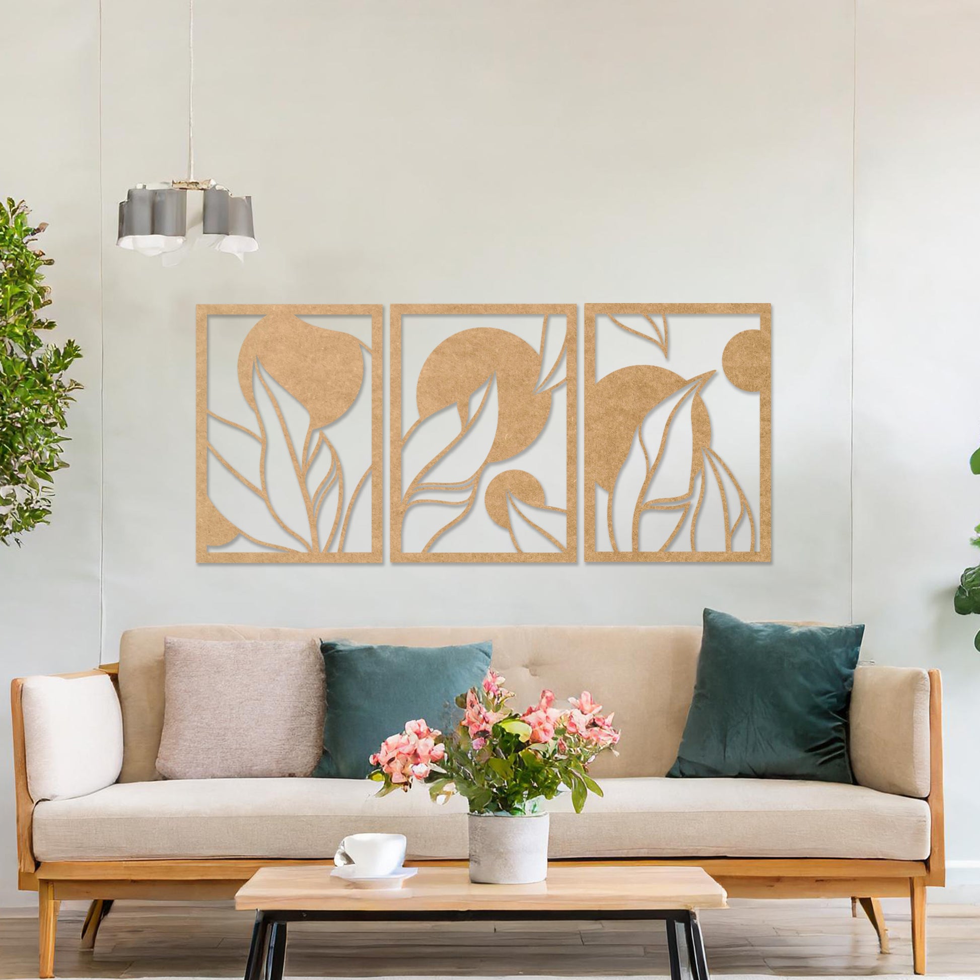Wooden wall art design featuring a three-panel composition with abstract shapes and flowing leaves, placed on a neutral wall within modern room decor. The design blends geometric forms and natural elements for a contemporary aesthetic.