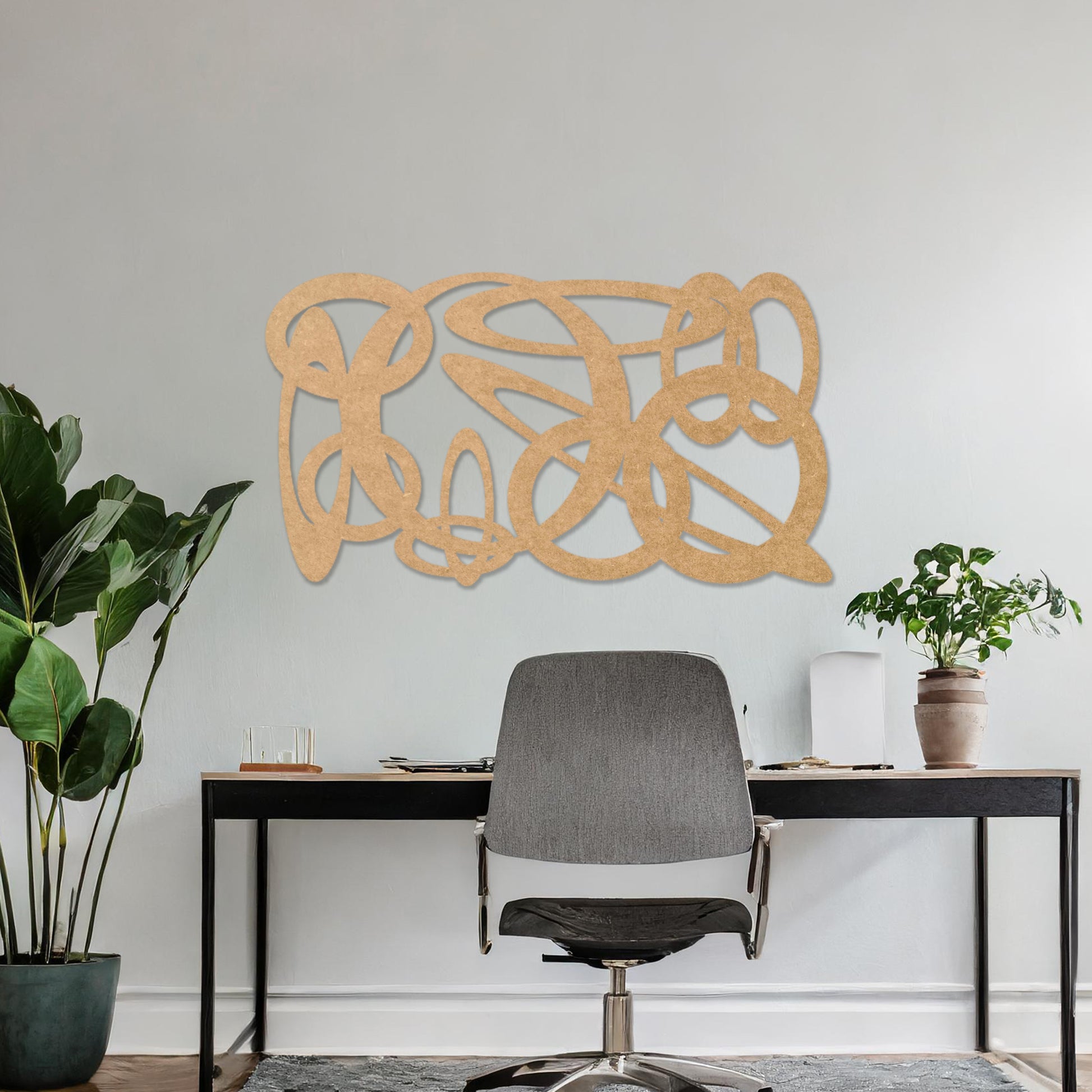 Wooden wall art design featuring an abstract composition of interwoven loops and shapes, placed on a neutral wall within modern room decor. The design combines flowing lines and organic forms for a contemporary, artistic feel.
