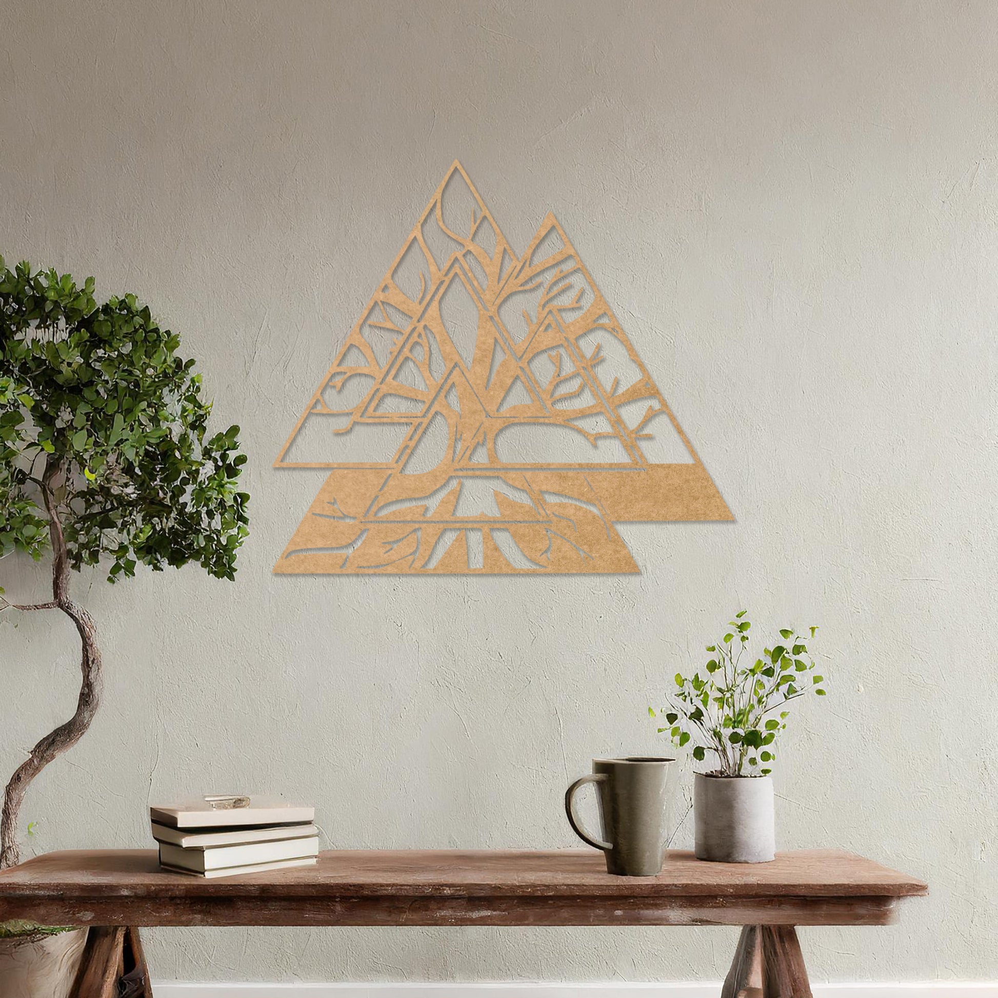 Wooden wall art design featuring a geometric triangular shape with intricate tree branches interwoven inside, placed on a neutral wall within modern room decor. The design combines nature and geometry for a contemporary, artistic expression.